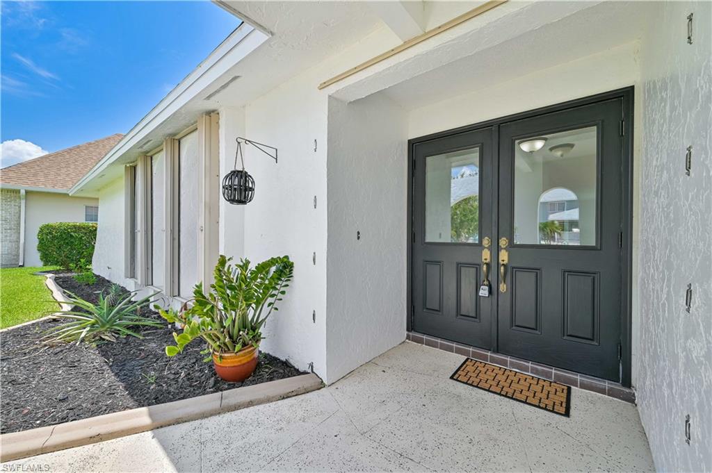Welcome to SAVONA..RENOVATED move-in ready POOL HOME! 3 Bed/ 3 Full Bath 2 large master suites with custom double-sink vanities, walk-in showers, and walk-in closets. The home has a welcoming covered entryway and lovely laminate waterproof floors are throughout the house that opens to a large living room loaded by natural light from three large windows. The kitchen has custom wood cabinets with soft-closing drawers/doors. Matching Whirlpool appliances, granite countertops, and a large butcherblock island that seats several. The open floor plan is perfect for entertaining on the island and easy traffic flow into the family room overlooking the lanai and pool. Formal dining room opens to the lanai and salt-water pool. Lanai has an outdoor shower and is fully screened, with custom remote hurricane screens for additional privacy/protection. Home has impact sliders and windows, and hurricane shutters in the front windows. Yard is fully fenced with a large grass area perfect for a fire pit or BBQ, and a large shed for storage. Sprinkler system throughout. Newer roof. Renovated laundry room under A/C, with washer and dryer. And a Large 2-car garage. Come see this home today!