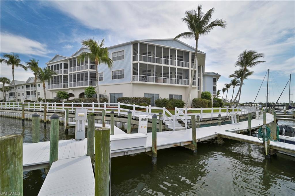 Rarely available 3 bed - 2 bath condo in the beautiful gated Boating Community of Boardwalk Caper. Enjoy the long great view of the canal and boats from your spacious lanai. Just one mile from the Fort Myers Beach sky bridge, you can walk, bike, or boat to the beautiful beach, Times Square, restaurants, and Pubs. A wide array of boat slips are available for lease or purchase. This beautiful unit is being sold Furnished Turnkey, Granite counters, custom mirrors throughout, new living room carpet, large lanai with electric hurricane shutters. It is handicap accessible with deeded under building parking, and elevator to top floor. This is new on the market. Don't miss it. Call, text, or email for showing today !