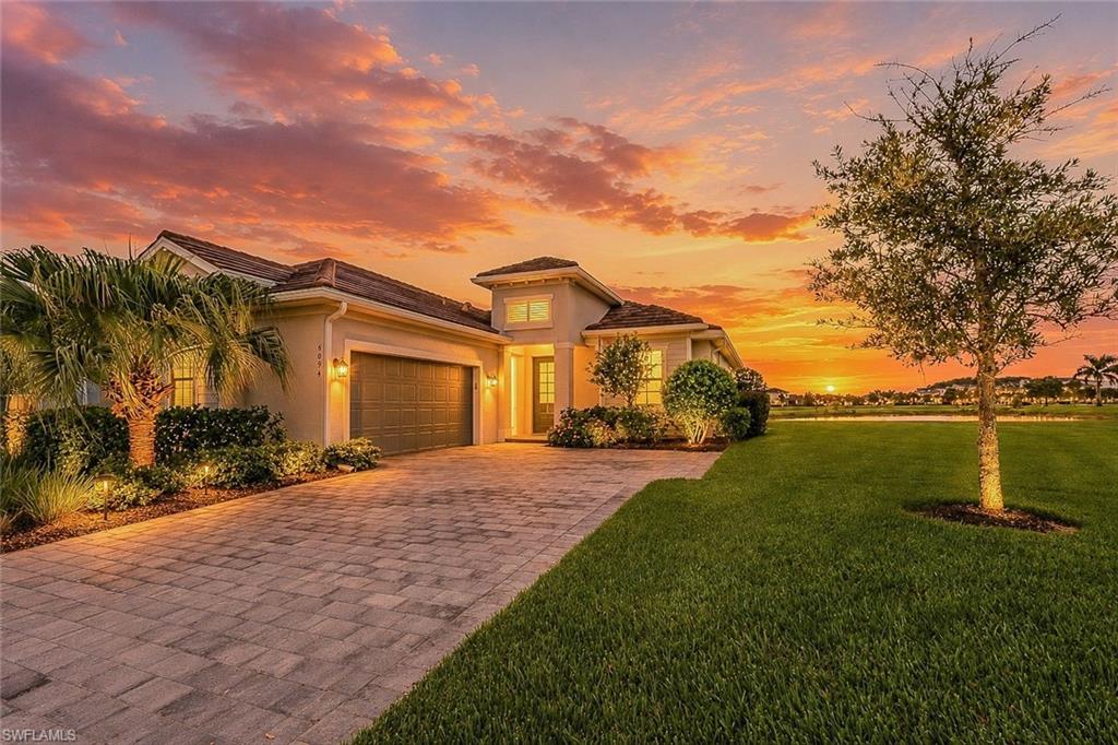 FORMER MODEL HOME | NEVER LIVED IN | DEEDED GOLF MEMBERSHIP INCLUDED | FULLY FURNISHED TURNKEY

Experience elevated resort-style living in this exceptional former model residence located within The National Golf & Country Club at Ave Maria. Never lived in and professionally designed by Gouse Fine Furniture, this stunning Victoria floor plan is being offered fully furnished turnkey and includes a bundled deeded golf and social membership, providing immediate access to one of Southwest Florida's premier golf and lifestyle communities.

Situated on a rare estate-sized homesite that was originally part of the exclusive model park, this one-of-a-kind property enjoys breathtaking eastern exposure overlooking a sparkling lake and manicured golf course fairways. With 1,850 square feet of thoughtfully designed living space, the home features two spacious bedrooms, a versatile den, two full bathrooms, and a powder bath.

Luxury finishes are showcased throughout, including elegant tile flooring, crown molding, custom beam details in tray ceilings, designer lighting, custom window coverings, premium ceiling fans, and quartz countertops. The open-concept floor plan seamlessly connects the gourmet kitchen, dining area, and great room, creating an inviting atmosphere ideal for both everyday living and entertaining.

Step outside to your private outdoor oasis where an expansive covered lanai offers the perfect setting to relax or entertain. Enjoy the custom outdoor summer kitchen complete with beverage refrigerator, pool and spa, and spectacular long water and golf course views.

Residents of The National enjoy an unmatched amenity package centered around an 18-hole championship golf course and a world-class amenity campus. Enjoy pickleball, tennis, bocce, a full fitness center, aerobic and yoga studios, and a vibrant calendar of social events. Relax at the luxurious day spa, unwind at the resort-style pool with lap lanes, or enjoy the privacy of the community's satellite pools. Multiple dining venues offer both indoor and outdoor dining experiences, while the club's elegant new restaurant and bar provide the perfect setting for entertaining family and friends. Additional amenities include conference rooms and event spaces ideal for business meetings, private gatherings, and special occasions.

Living in Ave Maria is about becoming part of a vibrant, golf-cart-friendly community filled with charm, connection, and convenience. Residents enjoy local parks, walking trails, shopping, dining, a water park, year-round community events, and the popular weekly farmers market in the town center. It is a lifestyle that has become a model for master-planned living throughout Southwest Florida.

This extraordinary former model combines luxury, comfort, and convenience in a truly turnkey package. Skip the wait to build and begin enjoying the golf and resort lifestyle immediately in one of Ave Maria's most desirable communities.