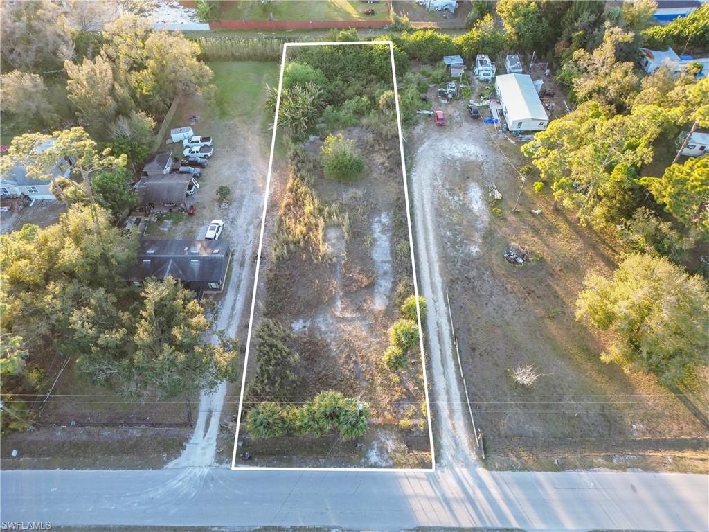0.58 ACRE LOT WITH NO HOA – NORTH FORT MYERS

Looking for land with no HOA where you can build or place a home? This spacious lot offers flexibility with no known deed restrictions in a growing area of North Fort Myers.

The property previously had a manufactured home and may have existing well, septic, culvert, and electric; however, these systems have not been used for several years and their condition is unknown.

Partially fenced with a gated entrance and natural tree coverage in the rear, providing added privacy and a peaceful setting. Conveniently located near shopping, dining, and major roadways with continued growth in the surrounding area.