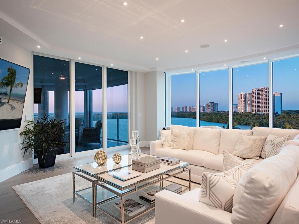 Unrivaled Gulf and bay vistas are showcased throughout this masterfully renovated end-unit in the highly-desirable Baypointe at Naples Cay.  Unlike many others in the building, this unit offers a sprawling 2,830 sq. ft. of living space due to the entire east terrace and a portion of the west terrace having been glassed in with floor to ceiling windows, allowing owners to enjoy the both dynamic and dramatic water vistas from every vantage point.  The unit offers a great-room style floor plan that hosts three spacious bedroom suites, a terrace facing directly west where owners can revel in Naples' sunsets, and a truly gourmet kitchen touting an array of high-quality finishes, including quartz countertops and backsplash, custom cabinetry, top-of-the-line appliances, an oversized island with additional storage, double oven, and wine refrigerator.  Additional notable enhancements include stunning wood-look tile flooring throughout, intricate tile designs in every bathroom, Lutron lighting, whole-unit sound system, and so much more.  Nestled between Park Shore and Pelican Bay, this residence is located in Naples Cay, a community offering boardwalk access to the sugar sands Naples is prized for just steps away, as well as a plethora of amenities including guest suites, tennis courts, swimming pool, kayak storage, and a fully-equipped fitness center. Notwithstanding the aforementioned highlights, Baypointe at Naples Cay is also strategically close to the upscale shopping and dining found at Waterside Shoppes and Venetian Village, as well as the Artis-Naples.
