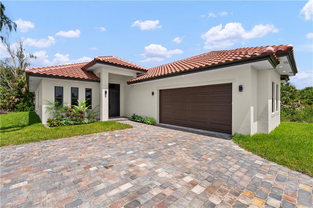 Private Acreage Living, New Construction Excellence! Tucked away in one of Naples' most peaceful enclaves, this new construction home sits near Shady Hollow Blvd in Golden Gate Estates — just 1.7 miles from the CREW Bird Rookery Trail and worlds away from the pace of city life. Set on over an acre that backs directly to a freshwater canal, the property offers a rare luxury for new construction in this price range: the ability to cast a line from your own backyard. This home was built to stand apart from the area's typical new construction offerings. A long, brick-pavered driveway leads to a striking barrel tile roof, setting an elevated tone before you even step inside. The thoughtful 3-bedroom-plus-den layout offers flexibility for a home office, media room, or guest retreat, while 2 full baths and a conveniently placed guest bath — accessible directly from the spacious covered lanai — make indoor-outdoor living effortless. The lanai is already equipped with connections for an outdoor kitchen, ready for the new owner's vision of Naples entertaining at its finest. Despite its tucked-away, private feel, everyday convenience is close at hand — restaurants, grocery stores, a gas station, and a pharmacy are all within 3 miles, and the white sand shores of Vanderbilt Beach are just 17 miles away. With no HOA fees and no HOA restrictions, this property delivers the space, privacy, and freedom that make Golden Gate Estates so highly sought after. *Please Note - Images Virtually Staged for Layout Purposes. Property does not come with an Outdoor Kitchen, the connections are there for a 3rd party Outdoor Kitchen or a Built-in Outdoor Kitchen can be added for an additional $3,500 by the builder. Property includes a One Year Home Warranty and a Professional Cleaning at Closing.