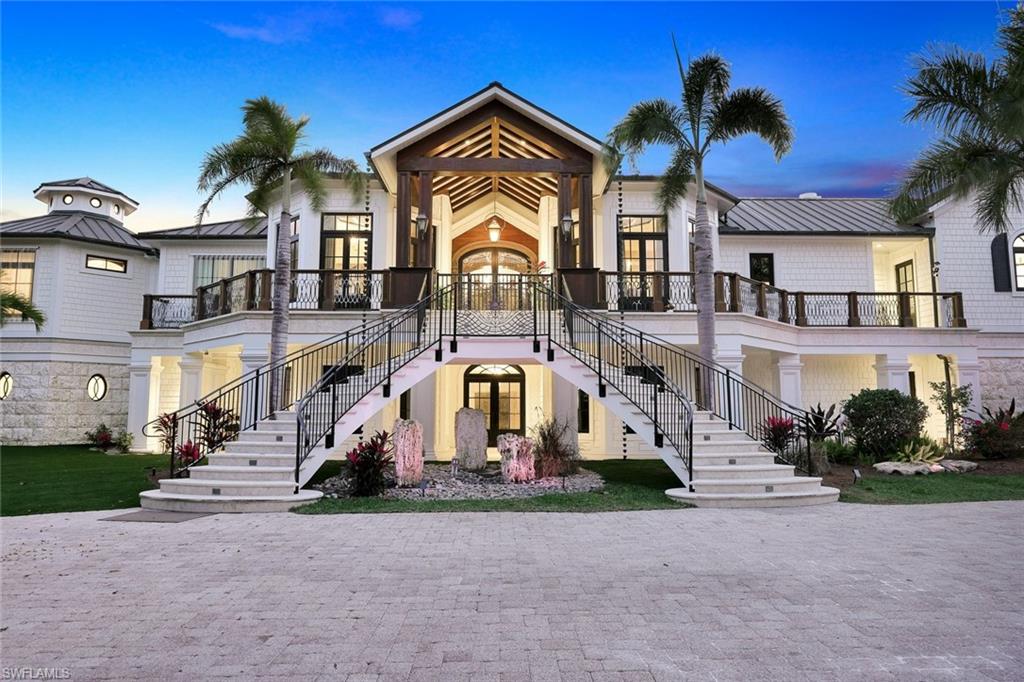 Set on 4.55 acres at the very end of West Gulf Drive, known as Sanibel's prestigious Gold Coast, on a private cul-de-sac, this extraordinary beachfront estate offers 245 ft of direct Beach & Gulf frontage, exceptional privacy, and a caliber of craftsmanship rarely seen anywhere in SWFL. Built without compromise, and running parallel to the sunset, allowing the home to capture Sanibel’s legendary Gulf views & Sunsets. A rare legacy estate. Encompassing nearly 20,000 SF with 6 bedrooms, a private office, 6.5 baths, and white-sand beach & water views from every room. Grand in scale yet livable, conceived as a multigenerational coastal retreat, suited for intimate family life, extended guest stays, and entertaining. Professionally decorated & furnished, a reflection of craftsmanship. The great room is dramatic and refined, anchored by 3 custom Barlas Baylar chandeliers, a hand-carved Calacatta marble fireplace mantel, herringbone hickory floors, mahogany ceiling beams with integrated surround sound, and concealed air systems preserving clean architectural lines. A full-length illuminated bar with underlit crystal counters brings the ambiance of a private five-star lounge, while integrated Crestron & Lutron systems provide sophisticated control of lighting, media, comfort, and shade. A Chef’s kitchen & separate service kitchen are outfitted with Thermador Pro Appliances, custom cabinetry, designer hardware, and a full butler’s pantry, ideal for private chef service & entertaining. An elevator provides seamless access across levels, while a dumbwaiter offers discreet convenience for household needs. Custom hand-crafted doors highlight the home’s attention to detail. Built to exceptional standards, the residence features a copper roof w/ matching copper gutters, $1.4M in Hartman windows & doors, and full hurricane shutters for an exceptional level of coastal protection. The Primary Wing offers 2 Gulf-front suites and office. The primary suite features a fireplace, private balcony overlooking the Gulf, direct beach access, a morning kitchen, advanced security features, and an exceptional bath w/ indoor & outdoor showers, a steam shower, an extraordinary walk-in wardrobe, dedicated laundry, Toto toilets in every bathroom. Guest accommodations are designed to provide comfort & privacy, including a 3rd-level suite with breathtaking views of Sanibel’s celebrated sunsets. Beyond its principal living spaces, the home offers scale to have a private gym, spa, game room, and lifestyle spaces tailored to multigenerational living & extended guest stays. Outdoor living rivals a luxury resort, w/ a beachfront pool & spa, lap pool, outdoor kitchen, lounge pavilion with reclaimed wood & fireplace, and a beachside putting green. Additional lot separately available, offering the opportunity to expand or create a private compound. Framed by palms, Gulf breezes, and the sound of waves, this ultra-private residence is one of the most significant estates in Florida.