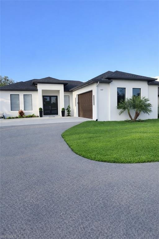 Move-in ready and built in 2023, this beautifully designed home offers the perfect blend of modern elegance, comfort, and functionality in the highly desirable Golden Gate Estates. Featuring 3 spacious bedrooms plus a versatile den, 2 bathrooms, and an open-concept layout with soaring ceilings, the home is filled with natural light and thoughtfully designed for everyday living and entertaining.

The gourmet kitchen is the heart of the home, showcasing a large center island, contemporary finishes, and abundant cabinetry. The master bedroom offers a relaxing retreat with dual walk-in closets and a very nice bathroom.

Additional, includes impact-resistant windows and doors, a whole-home security system, automatic sprinkler system, reverse osmosis system, and a spacious laundry room. Situated on a 1.14-acre lot, this property provides the perfect balance of privacy and convenience, just minutes from the new Publix, shopping, dining, and Big Corkscrew Island Regional Park.