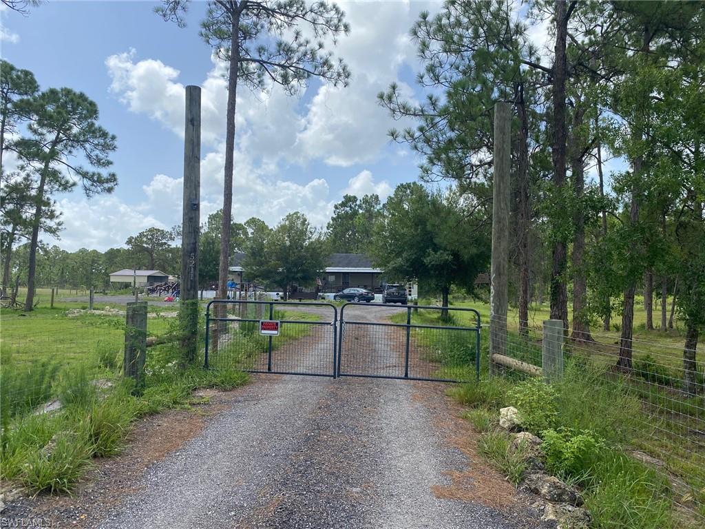 This 2005 Modular beauty is a spacious 4 bedrooms and 2 baths and sits on 5 acres! It boasts high ceilings that give it a great open feel! The master bedroom has a huge walk-in closet and sliding glass doors to the outside deck. A very nice covered wood deck front porch with rails goes the whole distance of the house, wonderful for enjoying nature! The property is fenced, has a fireplace, and new gas hot water heater. The kitchen stove also runs on gas. Washer and dryer located inside! Not too many properties like this! Very private and retreat-like. Come see for yourself! Call today!