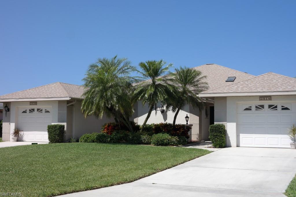 TURNKEY, GULF ACCESS, DUPLEX with a POOL & Outdoor Kitchen (complete with Gen-Air Grill)-PLUS a BREATHTAKING VIEW that will INSPIRE you to sit back, RELAX, and enjoy life as if you're on VACATION!  Are you looking to share a home with a family member or friend but need a LITTLE BIT of privacy or perhaps you'd like your own space, but still want to live near your friend or relative?  Or are you looking to take advantage of living on one side and RENTING out the other? Either way this home/duplex is PERFECT for you!  This duplex home has been cared for gently by the original owners, and is being offered as-is, as it includes just about EVERYTHING!  The neighborhood is GORGEOUS, the GULF ACCESS is phenomenal, and the price is RIGHT!  Don't wait until it is too late to own your piece of paradise-schedule your private showing today!  Agents, please see confidential comments.
