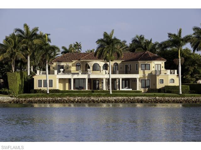 Incomparable views of Naples Bay and beyond. Attention to detail throughout with no expense spared in the use of warm woods and intricate stonework. A rare opportunity. Port Royal Club eligibility.