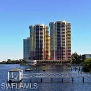 SELLER FINANCING AVAILABLE!!!  This 1 bedroom unit enjoys direct water views of the river and westward towards the bridge.  The night sky is stunning from the second story loft and lanai.   Tiled throughout all main floor.  Raised panel cabinets and breakfast bar.  Second floor laundry makes this chore a breeze.  Great room has 20+ foot high ceilings.  Enjoy sunsets from your lanai or maybe in the pool or spa overlooking the river.  You will not be disappointed!   Private park on the river to take a stroll and even pet friendly.  Enjoy your workouts in the new exercise facility or walk to downtown events, shopping, entertainment and dining.  During season enjoy the free trolley service or maybe take in one of the planned social activities at St. Tropez in the Riviera Room. Virtual tour is showing amenities and larger unit.    LIVE THE WATERFRONT LIFE