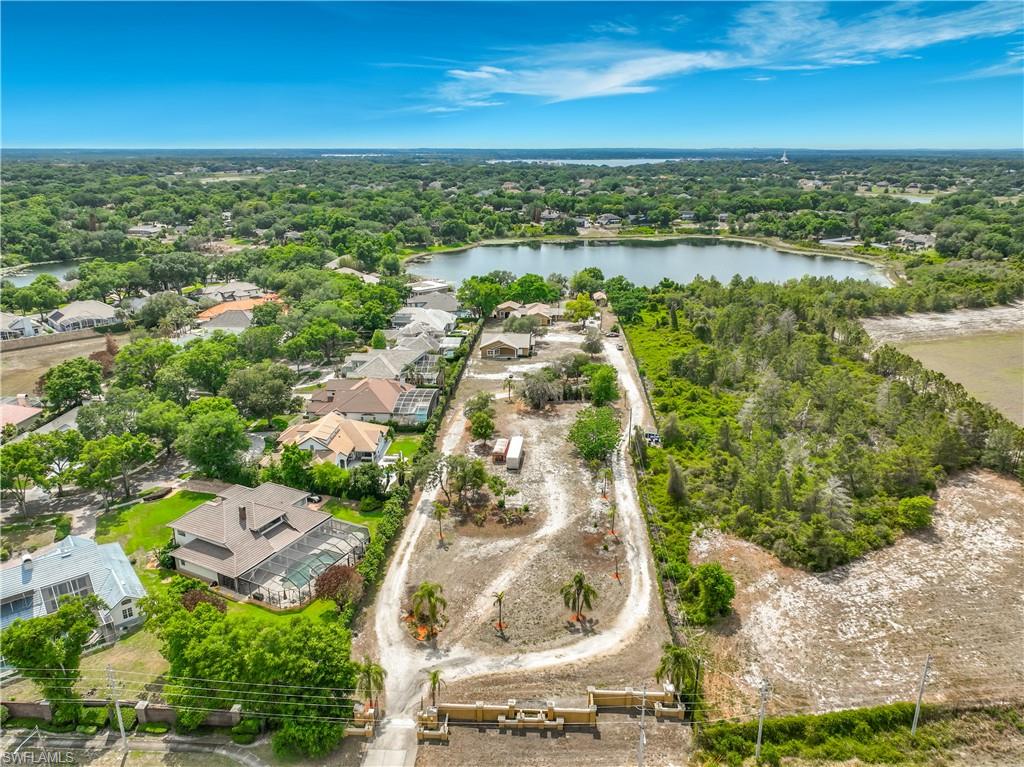 OVER 5 ACRES, RIGHT IN THE HEART OF ORLANDO, WITH MULTIPLE STRUCTURES, A BASKETBALL COURT, AND EXPANSIVE LAKE FRONTAGE — NO HOA!

This one-of-a-kind property includes two parcels totaling more than 5 acres and is being sold together. The seller will not separate the parcels.

The main residence features a spacious 3-bedroom + den, 3-bathroom floor plan with a large kitchen and an open great room designed for entertaining. The third bedroom, full bathroom, and den/living area have a private entrance, making it ideal for multigenerational living, guest accommodations, or potential rental income.

Outdoor amenities include a full basketball court with restrooms and a covered grilling area, creating the perfect setup for recreation, events, or gatherings. The expansive lakefront setting offers opportunities for canoeing, kayaking, and fishing, all while enjoying peaceful waterfront views.

The second parcel includes an additional versatile structure that was most recently used as a workout facility. Complete with a full kitchen, office space, full bathroom, and one-car garage, this building offers endless possibilities for personal, recreational, or business use.

Rarely does a property of this size and versatility become available in the middle of Orlando. Whether you are looking for a private family compound, income-producing opportunity, event space, or recreational retreat, this unique waterfront property offers unmatched potential with no HOA restrictions.