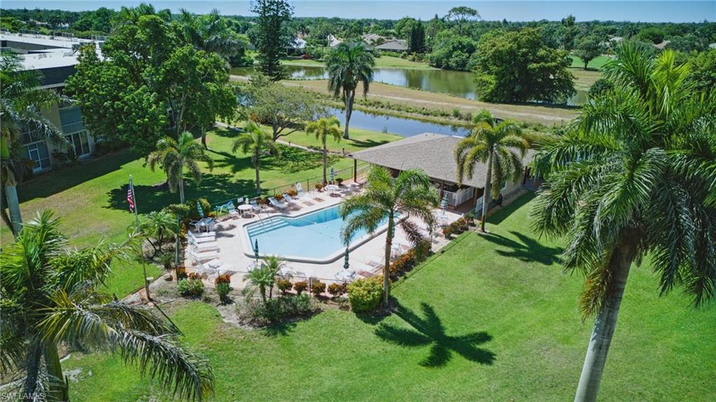 Enjoy easy, low-maintenance living in this TURNKEY FURNISHED condominium, ideally situated just a short drive from Naples' beautiful Gulf beaches, downtown restaurants, shopping, and everyday conveniences.  This 3rd-floor, 2-bedroom, 2-bath condominium offers over 1,100 square feet… A thoughtfully designed floor plan provides living options for both owners and guests, featuring a spacious primary suite with an ensuite bath and a separate guest bedroom and full bath with a pocket door, making it ideal for guests or home office.  The kitchen features updated WARM WOOD CABINETRY with coordinating countertops, and newer impact-resistant windows throughout offer added peace of mind, energy efficiency, and storm protection. An electric hurricane shutter on the rear screened lanai provides another layer of convenience, and the COMMON ELEVATOR makes access to the third floor easy. Enjoy an additional space of outside living and dining from the SCREENED LANAI—the perfect place to enjoy your morning coffee or unwind after a day at the beach. Whether you're looking for a year-round residence, a seasonal Florida retreat, or an investment opportunity, this home offers exceptional value…CABLE & INTERNET ARE INCLUDED in the condominium fees, making ownership even more convenient.  A COMMUNITY POOL and COVERED CARPORT are another benefit you will enjoy!  Country Club Manor is a 55+ community.  Buyer to verify all information.