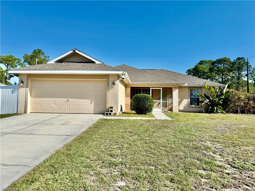 Affordable 3 bedroom 2 bath home with a double garage, FENCED BACKYARD, double gate on one side for additional RV, truck or boat parking inside the fenced area, NEW DIMENSIONAL SHINGLE ROOF IN 2024, NEW CENTRAL HEAT AND AIR IN 2025, NEW WATER HEATER IN 2020, screened front porch, cathedral ceilings and plant shelves, wood floors in the living area with ceramic tile in the kitchen, baths and indoor laundry room, breakfast bar and pantry in kitchen with all kitchen appliances, primary bedroom with walk in closet and private bath with dual sinks, long vanity and walk in shower, built in desk in between the two guest bedrooms, double garage with opener plus laundry tub, sliding doors from the main living area to the 29 X 10 screened lanai overlooking the backyard plus a 19.5 X 8 open patio, plenty of room for entertaining, excellent location just minutes to I-75, Ft Myers and the SWFL International Airport. NO FLOOD INSURANCE REQUIRED. LEHIGH IS THE HIGHEST ELEVATION IN LEE COUNTY.
