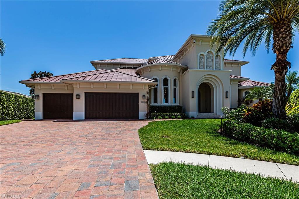 Come and experience waterfront living at its finest in this custom-crafted boater’s treasure with spectacular wide water views. Majestically positioned on a tip lot location with sunny southern exposure, this spacious great room design with 4 bedrooms plus family room and 5 baths is beautifully furnished and ready to move right in. Indulge in casual coastal elegance from the open living area to an inviting and expansive outdoor tropical ambiance. Details and finishes throughout are of the highest quality materials and finest craftsmanship found today. This superb boater’s location features 195 feet of waterfront with quick direct access to the Marco River including expansive dock space with a 40K lb lift and a special 12K lb cut-in jet ski platform. Enjoy the scenic water views, entertain or just relax by the large sparkling infinity-edge pool with an exceptional state-of-the-art summer kitchen. This is your tropical treasure ready to be found today.