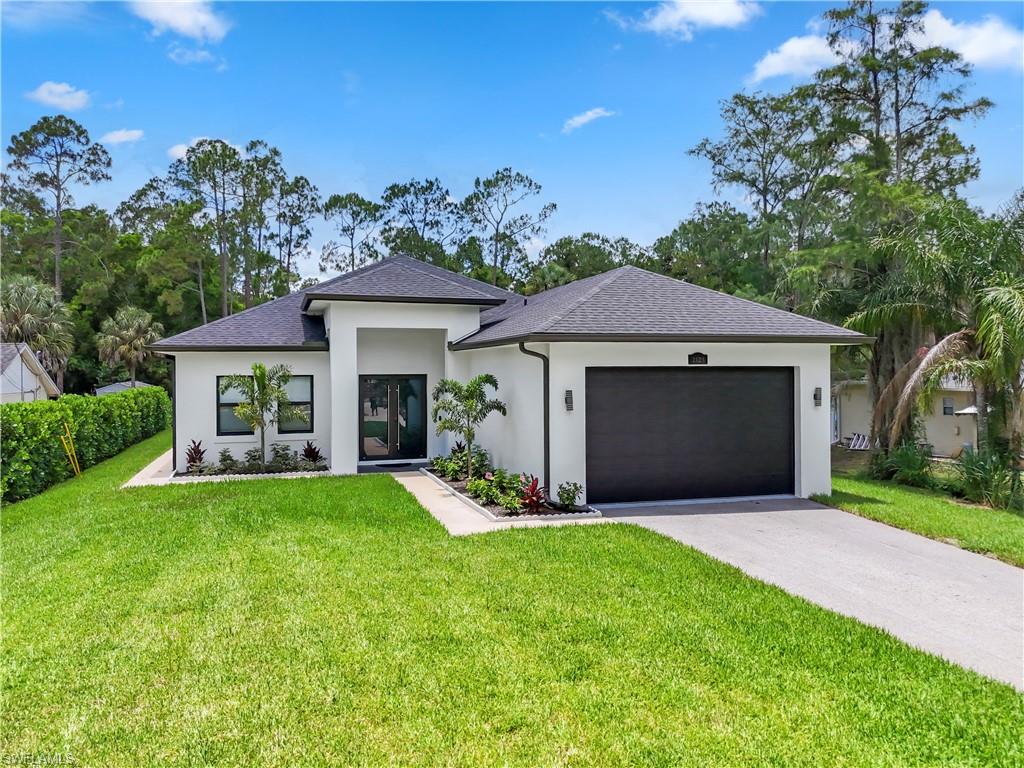 Welcome to this custom-designed home, offering 3630 total square feet on1.14 fully upland acres in the sought-after Golden Gate Estates, with no HOA and no CDD fees. Home offers the option to add 2 rental properties wirh simple changes ( must see) 
Built for durability and long-term quality, impact-resistant windows and doors, and a whole-house reverse osmosis water system.
Inside, the home impresses with 12-foot coffered and tray ceilings, upscale lighting, and elegant wood-look porcelain tile throughout. The centerpiece is a gourmet kitchen with granite countertops, a breakfast area, and a wet bar—perfect for entertaining.
The private owner’s suite offers a peaceful retreat with a luxurious bathroom and two spacious walk-in closets. Across the home, you’ll find three generously sized guest bedrooms, including both with its own en-suite bath and two with its own kitxhen with a separate private entrance, ideal for extended family or multi-generational living.
The indoor spaces open seamlessly to a large screened lanai, where you can enjoy the outdoors year-round, and take in the beautifully maintained Floratam lawn. 
Completing the property is an oversized insulated 2-car garage, making this exceptional custom estate a truly unique opportunity.