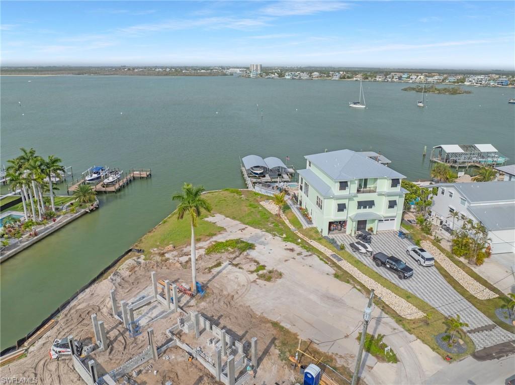 Introducing an exceptional direct bayfront lot on the prestigious north end of Fort Myers Beach — an area now transforming with a collection of newly built ultra-luxury estates that are redefining the island’s skyline. This rare parcel offers a premier opportunity to design a signature residence or duplex in one of the most coveted waterfront corridors on the island.
Set along the shimmering expanse of Estero Bay, the property delivers unobstructed panoramic water views, daily marine life activity, and effortless Gulf access from your future private dock. The white sands of Fort Myers Beach lie just across the street, creating a true dual-waterfront lifestyle — beach out front, boating out back.
Zoned for either a single-family home or duplex and located within a short-term rental district, this lot offers exceptional flexibility for luxury living, high-end rental income, or a combination of both. With no HOA or club fees, owners retain full control over design, use, and long-term value.
Surrounded by a growing enclave of multimillion-dollar custom homes, this property stands as a premier canvas for a showpiece build. Its 53-year legacy of single-family ownership underscores the rarity and desirability of this location — a place where memories have been made for decades and where a new owner can now create an extraordinary coastal retreat.
A direct bayfront lot in a rapidly elevating luxury neighborhood, with beach access steps away and Gulf boating at your back door, represents one of the strongest long-term investment plays on Fort Myers Beach