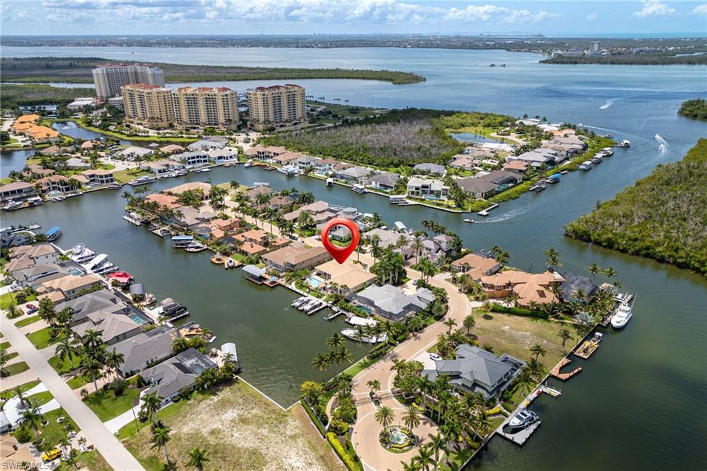 Welcome to an exclusive waterfront opportunity in the prestigious Hermitage gated community of Cape Coral. Perfectly positioned on a deep-water canal with direct Gulf access and just minutes to the Caloosahatchee River, this remarkable residence offers the ultimate Southwest Florida boating lifestyle.

Designed for both relaxation and entertaining, the home features 4 spacious bedrooms, 3.5 bathrooms, a large kitchen, a private media room upstairs and a desirable 3-car garage. Boating enthusiasts will appreciate the two boat lifts installed in 2024, providing ample space for multiple vessels and effortless access to world-class fishing, island destinations, and open Gulf waters.

Inside, expansive living spaces create a seamless flow for everyday living and hosting guests, while large windows and sliding glass doors showcase beautiful waterfront views. Multiple indoor gathering areas are complemented by generous outdoor living spaces, allowing you to enjoy Florida's year-round sunshine, waterfront dining, and spectacular sunsets.

Whether entertaining family and friends, setting out for a day on the water, or simply enjoying the tranquility of this exclusive enclave, this home delivers an unparalleled waterfront lifestyle. Conveniently located in the vibrant Cape Harbour area, residents enjoy easy access to waterfront restaurants, boutique shopping, entertainment, and marina amenities.

This is a rare opportunity to own a premier Gulf-access property in one of Cape Coral's most sought-after gated communities—ready for its next homeowner to enjoy everything this exceptional residence and its coveted location have to offer.