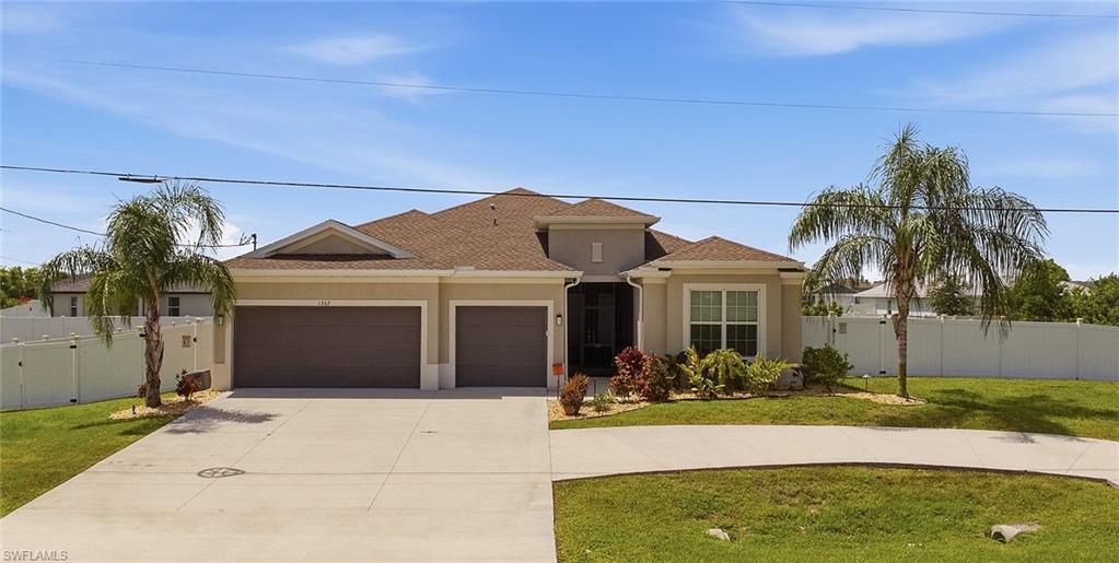 Welcome to this beautiful 2,434 sq ft single-family home build in 2023 with 3 bedroom + Den, 3 full baths offering the space, style, and outdoor lifestyle SWFL buyers love. The home features tile flooring throughout the home, try ceilings in the large great room and primary bedroom.  The large gourmet kitchen is a showstopper, featuring a pantry and a massive 15-foot island that doubles as a breakfast bar - perfect for entertaining or everyday family life.   Retreat to the ample sized primary suite with tray ceiling, and the en suite boasting an oversized walk-in shower and dual sinks.  One of the other bedrooms functions as a guest suite complete with it's private full bath providing comfortable accommodations for family or guests.  Step outside to your private resort-style oasis: a screened-in lanai with paver deck surrounds the pool, complemented by an oversized spa and sun deck for ultimate relaxation. Movie nights are elevated with a built-in projector and screen right on the lanai. The fully fenced yard sits on an extra-large triple lot - approximately 1/3 acre. Your Florida oasis is here!
