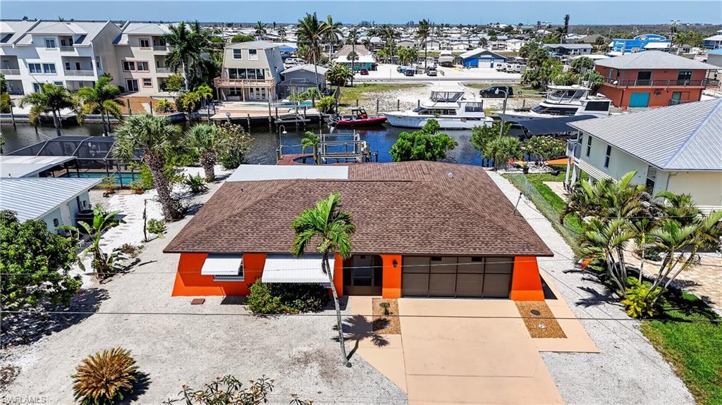 ST.JAMES CITY-PINE ISLAND! THE "SALT LIFE" FISHING-BOATING-BEACHES IS CONSIDERED ISLAND LIFE HERE! THIS CUTE "FISHERMAN'S COTTAGE" IS "FLORIDA KEYS" STYLED LAID BACK ISLAND LIVING, YET CLOSE TO EVERYTHING! COMPLETE HOME REMODEL (2024) OVER $250,000+/- AS GONE INTO THIS FURNISHED "TURNKEY" 3BDR, 2TH, 2 CAR GARAGE, DOCK, and Boat LIFT. OPEN FLOOR PLAN, ALL TILE FLOORS THROUGHOUT FOR EASY MAINTENANCE, ALL NEW ELECTRICAL AND PLUMBING WENT INTO THE REMODELING OF THE HOME. ALL TILE FLOORS, NEW A/C, BRAND NEW ROOF 2023, ALL WINDOWS & DOORS ARE PROTECTED "IMPACT STORM" RESISTANCE "BAHAMA AWNINGS" FOR TOTAL PROTECTION. NEW REMODELED KITCHEN WITH WHITE SHAKER CABINETS, ALL STAINLESS STEEL APPLIANCES & LEVEL 5 QUARTZ TOPS. HUGE MASTER BEDROOM, WALK IN CLOSET, GRANITE VANITY, FLOOR TO CEILING GLASS & MARBLE WALK-IN SHOWER. BOTH GUEST ROOMS HAVE BEEN COMPLETELY REMODELED INCLUDING THE BATHROOM. HOME HAS A COVERED LANAI FOR ENJOYING THE WATERFRONT AND FANTASTIC "SUNSETS" YOU GET IN THE EVENINGS SHADE. HOME HAS A "CAPTAINS" WALK AROUND DOCK WITH (10,000LB) LIFT WITH WATER & ELECTRIC FOR ALL FOR BOATING NEEDS. OPEN WATER IS A SHORT 10 minutes excursion.  NEW 2023 A/C WITH WARRANTY. THE LANDSCAPING OF THE HOME "ZERO SCAPE" WAS DESIGNED WITH EASY MAINTENANCE AND THERE IS PLENTY OF ROOM FOR A POOL (POOL PROPOSAL PLANS ARE FOR $43,000). TALK ABOUT RENTAL APPEAL, COULD BE A HUGE RENTAL ATTRACTION PROPERTY WHEN NOT IN PERSONAL USE! HOME COMES WITH 1 YEAR HOME WARRANTY FOR TOTAL BUYER COMFORT.