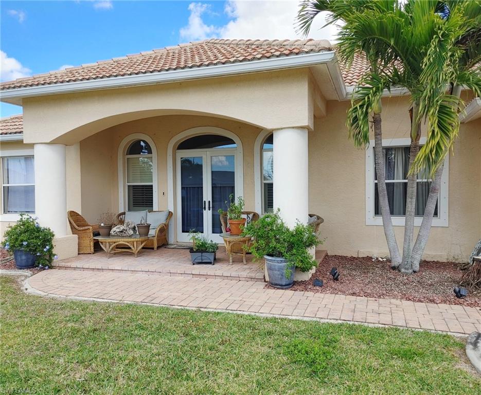 Gorgeous pool home on a freshwater canal with ICF (insulated concrete form construction) for a highly energy-efficient structure. This home offers great curb appeal including a tile roof, paver driveway, arched windows & a glass double door entry. You enter into the welcoming great room with volume ceilings, crown molding, a spacious living room & a formal dining room with elegant columns. The beautiful kitchen is the heart of the home with attractive wood cabinetry, granite countertops & stainless steel appliances. Enjoy your morning coffee in the breakfast nook with views of the pool & lovely canal. The private master suite features a large walk-in closet & an en suite bathroom with dual sinks, granite countertops, a large tiled shower & a garden tub for relaxing! The split bedroom floor plan features 2 bedrooms & a full bath in the front of the home & a fantastic den/guest bedroom & full bath at the back of the home which serves as a pool bath. The laundry room features wood cabinetry, a granite countertop & convenient sink. Entertain friends & family on the screened lanai with a beautiful paver deck, a sparkling pool & a fenced yard with amazing views of the peaceful canal.