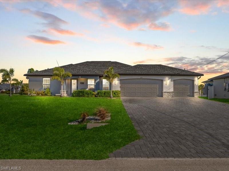 Exceptional Living in One of NW Cape Coral's Most Desirable and Rapidly Growing Communities

Perfectly positioned just minutes from Crystal Lake Park, this impeccably maintained residence offers an exceptional combination of quality craftsmanship, modern upgrades, and everyday luxury. Featuring 4 spacious bedrooms, 2 beautifully appointed bathrooms, and an oversized 3-car garage, this home is designed to accommodate both comfortable family living and effortless entertaining.

From the moment you arrive, the upgraded paver driveway creates an impressive first impression. Inside, you'll discover a thoughtfully designed open-concept floor plan enhanced by tile flooring throughout the main living areas and wet spaces, professionally sealed grout for easy maintenance, upgraded LED lighting, and elegant plantation shutters.

The gourmet kitchen is both stylish and functional, showcasing granite countertops, premium stainless steel LG appliances, a double oven range, and an LG ThinQ smart refrigerator—perfectly suited for everyday living and hosting family and friends.

Additional premium features include a whole-house reverse osmosis water system, offering purified water throughout the home, along with an expansive screened lanai that seamlessly extends your living space outdoors, creating the perfect setting to relax, dine, or entertain year-round.

For those seeking even greater possibilities, the adjacent lot at 4321 NW 34th Lane is also available for purchase, presenting a rare opportunity to create a private estate, add additional outdoor amenities, or secure extra space for the future.

Located in one of Cape Coral's fastest-growing neighborhoods, with convenient access to parks, recreation, shopping, dining, and the exciting future development of the area, this exceptional property offers the perfect blend of luxury, comfort, and long-term value.

Experience the lifestyle you've been waiting for. Schedule your private showing today.