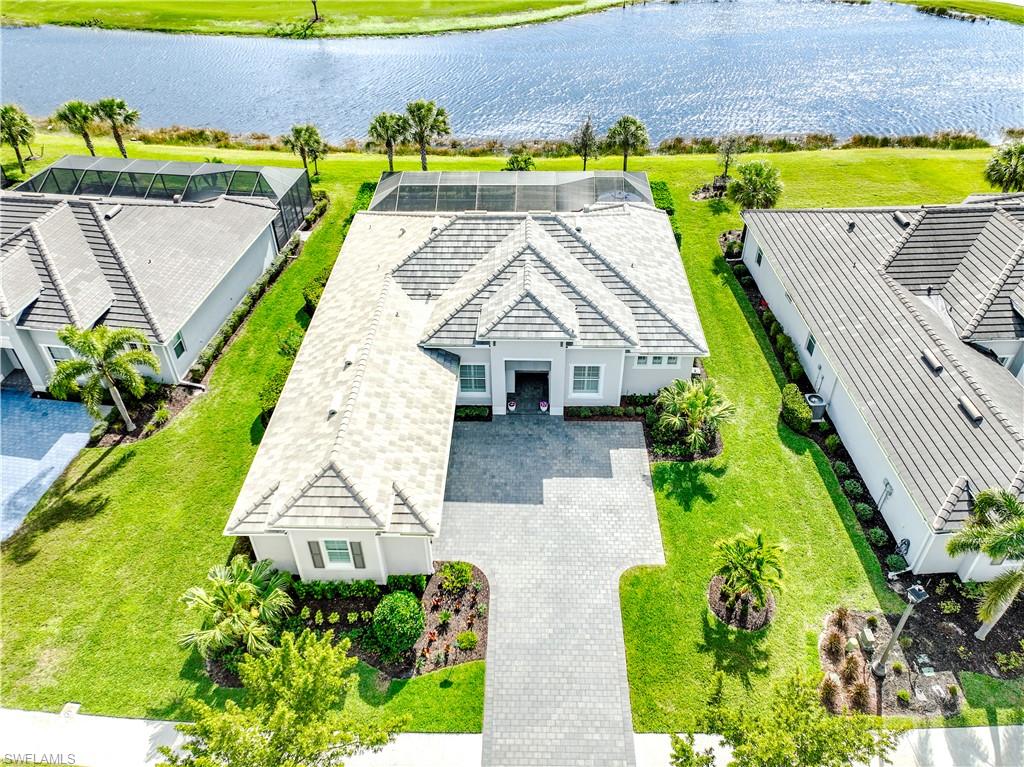 Golf Membership Included! Experience refined Florida living in this beautifully appointed 3-bedroom + den residence with a private pool and spa, ideally situated on a desirable south-facing homesite within the prestigious gated community of The National Golf & Country Club in Ave Maria.
Designed with both elegance and functionality in mind, this home showcases premium upgrades throughout. The owner’s suite and pantry feature custom California Closets, providing exceptional organization with a luxurious finish. Plantation shutters, designer lighting, and upgraded ceiling fans add timeless sophistication to every room. A stylishly updated half bath includes a new vanity and sink, enhancing the home’s modern appeal.
Seamless indoor-outdoor living awaits in your private pool and spa retreat, enhanced by a No-See-Um panoramic screen enclosure (March 2025) for uninterrupted views and year-round comfort. The beautifully designed outdoor kitchen creates the perfect setting for entertaining. The exterior has been meticulously refreshed with new exterior paint (December 2025), roof soft wash (December 2025), and updated exterior lighting (December 2025). Lush, upgraded landscaping further elevates the home’s curb appeal and grand sense of arrival.
As a resident of The National Golf & Country Club, you’ll enjoy access to world-class, resort-style amenities including a championship Gordon Lewis-designed golf course, grand clubhouse with formal and casual dining, resort-style pool with lap lanes and poolside bar, state-of-the-art fitness center, full-service spa, tennis courts, pickleball courts, and an active social calendar filled with events and activities. The community also features scenic walking and biking paths, gated security, and beautifully maintained grounds.
Beyond the gates, Ave Maria offers an exceptional lifestyle with a vibrant Town Center featuring restaurants, shopping, a Publix grocery store, Ace Hardware, medical offices, and year-round community events. Residents enjoy access to multiple parks, playgrounds, sports fields, a water park, dog parks, scenic lakes, miles of walking trails, and the iconic Ave Maria Town Center with its charming piazza and community festivals.
This exceptional property offers the perfect blend of luxury, privacy, and resort-style living — all within one of Southwest Florida’s most sought-after golf communities,