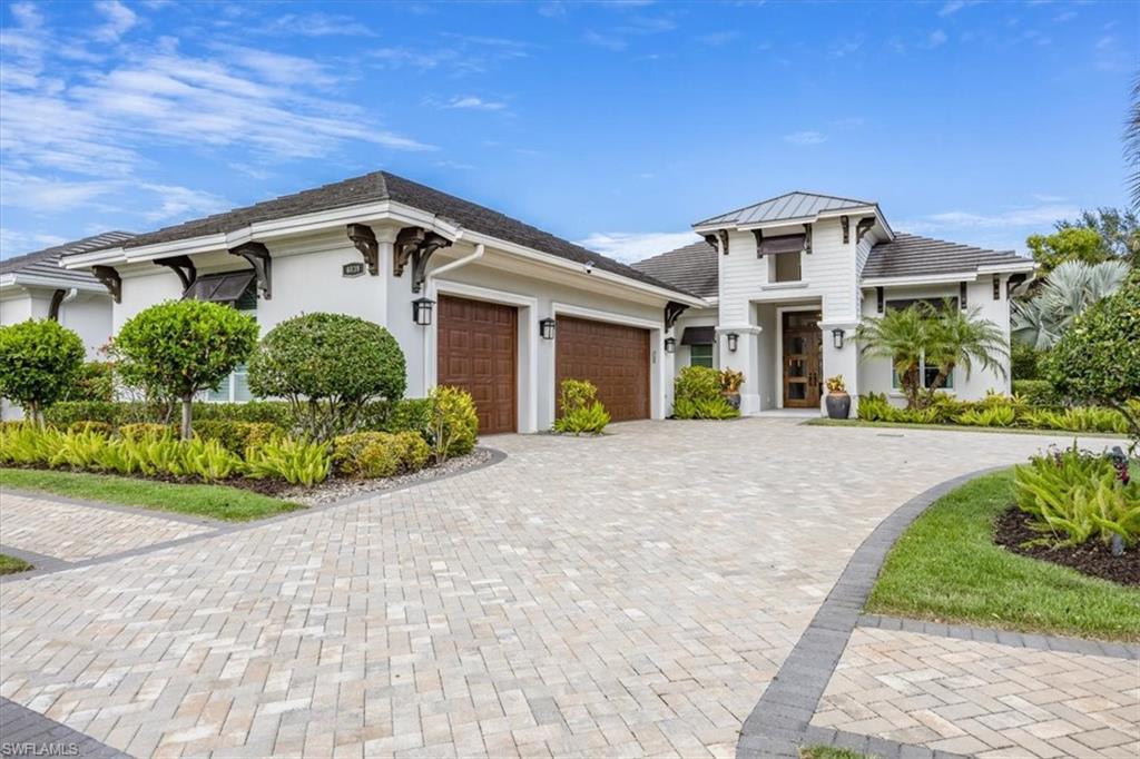 “Live Life Beautifully In Southwest Florida” in this stunning Windward Isle’s model-like home.  Situated on a corner lot with circular driveway you will notice the distinct West Indies architecture of the home.  Entering thru Oversized Mahogany French Doors into this stunning turnkey furnished home.  Wood and tile floors throughout with a Great Room Style Floor Plan and Split Bedrooms for Privacy.  No stone left unturned when designing this home.  From the oversized island with Kohler Vault Sink to Thermador Appliances with 2 Ovens, 6 Burner Stove and Custom-Built Wooden Hood with Zephry Tornado III Insert.  The Lanai has an extra-large saltwater pool and spa with Sun Shelf & Waterfall Feature.  Great for entertaining with your gourmet outdoor kitchen that has a custom Dekton Orize countertop with Mitered edge.  Relax and enjoy your warm winters with a glass of wine and watching your favorite TV program sitting next to the gas fireplace with changing colors.  Lanai also has Armor Screen Storm Shutters and a No See-Um Insect Screen for comfort.  Whole house is equipped with Hurricane Impact Storm Windows & Doors, Crown Moldings, Trim detail, Control4 A/V System with Audio Speakers Throughout, along with California Closets in every Bedroom.  And we cannot forget about the garage...with spray foam roof deck, baseboards, Epoxy flooring, & electric water heater with circulating pump to elevate this to the next level.  Some other features are 500 gallon buried propane tank with remote monitoring, Quartz countertops throughout, Professionally Designed and Decorated with Electric Window Coverings, Designer draperies and furnishings.  From the moment you step into this home, you know how pristine this home has been treated and is deserving of a worthy homeowner that wants Elegance and Comfort in One Spectacular Place.  Windward Isle is located in the heart of Naples, FL.  Just 7 minutes to Mercato, 10 minutes to local beaches, 15 minutes to Olde Naples & 25 minutes to SW FL’s International Airport.