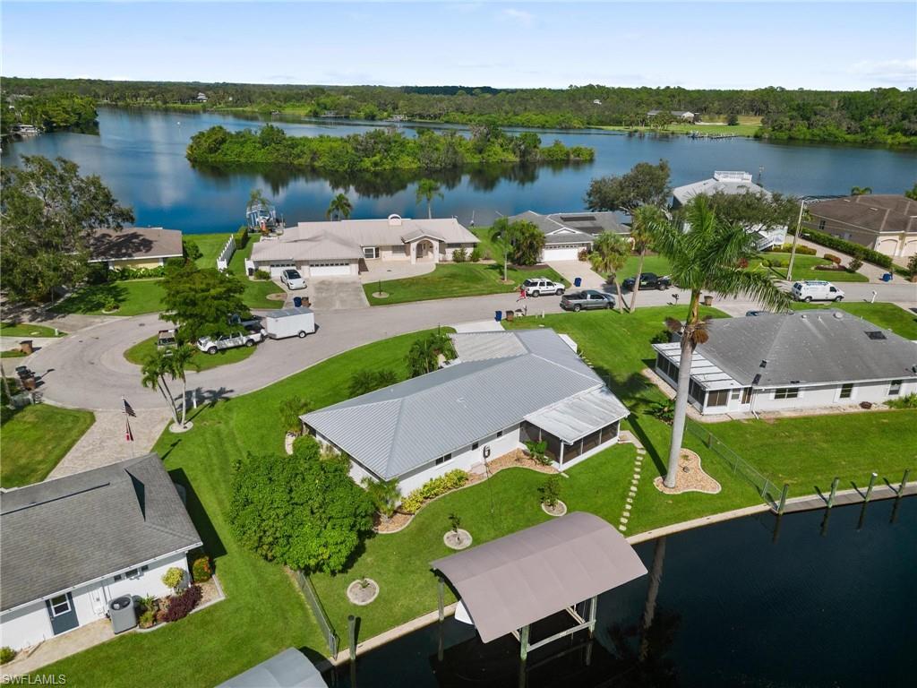 Welcome to your boaters paradise! This stunning 2 bed, 2 bath waterfront home is a dream come true for fishing and boating enthusiasts. With direct access to the Caloosahatchee river and a 10,000 lbs boat lift with canopy cover, your boat will always be ready for your next adventure. The Florida room offers the perfect spot to relax and soak in the breathtaking views. And when you're not out on the water, you'll love being just minutes away from incredible restaurants, shopping, and stores. Don't miss out on this opportunity to live the ultimate waterfront lifestyle.