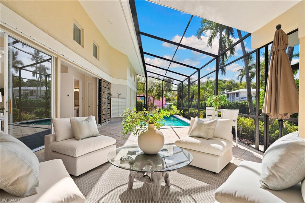 JUST REDUCED TO LOT VALUE! Situated in one of Old Naples desired coastal enclaves, just three blocks from pristine white sand beaches of the Gulf and a leisurely visit to iconic Fifth Avenue South and the new Four Seasons Naples Beach Resort, this private coastal residence presents an exceptional opportunity in an irreplaceable setting. On a desirable 0.23-acre corner homesite in the sought-after X Flood Zone, the property enjoys preferred southern and western exposure and is beautifully enveloped by mature landscaping, offering a rare sense of privacy in the heart of downtown. Influenced by mid-century architectural design, this four-bedroom residence, complemented by an office and an open loft, features a thoughtfully conceived floor plan within a generous two-story interior, creating an inviting backdrop for refined entertaining and future customization. Soaring ceilings and an open-concept living environment seamlessly connect the great room, kitchen and dining areas, all oriented toward a sun-filled outdoor oasis with an inviting swimming pool, classic paver decking, and a tranquil, landscaped backyard retreat, ideal for relaxed coastal living. Discreetly serviced by a two-car garage accessed via a private rear alley, the home’s elegant street presence is preserved, enhanced by a circular drive and curb appeal. For added peace of mind, the home is concrete block construction with steel roof trusses and situated in X-zone location. Set along one of Old Naples picturesque mahogany tree-lined streets, this exceptional offering blends timeless character, a premier location and limitless potential. Ideally just moments from the beach and world-class dining, refined boutiques, renowned galleries, theatres and vibrant coastal lifestyle that defines downtown Naples.