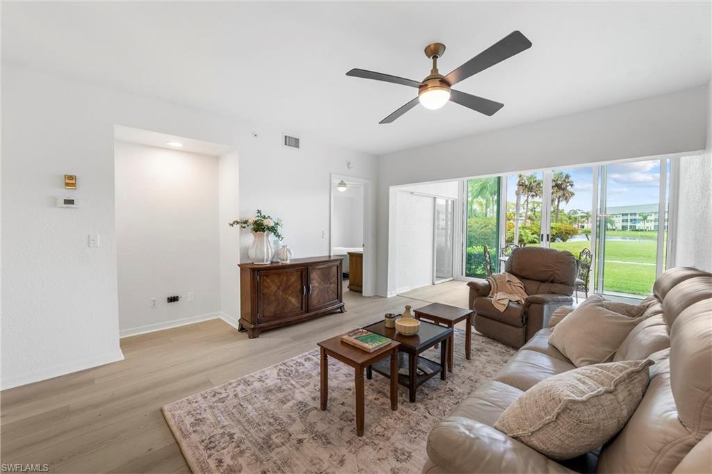 Within the gated community of Breckenridge, this desirable first-floor residence offers bundled golf and an active resort-style lifestyle in the heart of Estero. The two-bedroom, two-bath home combines updated interior finishes, functional living spaces and scenic golf course and lake views in one of Southwest Florida’s convenient locations. Inside, the residence features new flooring installed in 2026, renovated kitchen and baths completed in 2023, new appliances installed in 2023, quartz countertops, and impact glass windows and doors for added protection and efficiency. The open living and dining areas are designed for comfortable everyday living and entertaining, while large windows and sliding glass doors allow natural light to fill the space and highlight the peaceful surrounding views. One of the home’s standout features is the enclosed lanai, which has been converted into additional air-conditioned living space and features remote-controlled blinds, creating a larger interior footprint and offering flexibility for a sitting room, office or extended entertaining area. Overlooking the golf course and lake, the residence provides a relaxing setting with desirable Southwest Florida scenery. The primary suite includes a generous walk-in closet and a well-appointed bath with ample storage and functionality. The guest bedroom and additional bath provide comfortable accommodations for visitors or seasonal residents. Additional updates include a new water heater installed in May 2022 and a new air-conditioning system installed in May 2026. The residence also includes a covered parking space along with ample guest parking nearby for added convenience. Breckenridge residents enjoy access to bundled golf, tennis courts, pickleball, a resort-style pool, clubhouse, and a full calendar of social activities and amenities. Ideally in the heart of Estero, this residence offers easy access to Southwest Florida International Airport, Coconut Point Mall, Miromar Outlets, Gulf beaches, dining and entertainment throughout Southwest Florida.