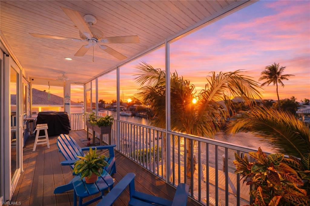 Experience the ultimate Southwest Florida waterfront lifestyle in this custom-built 2018 Insulated Concrete Form (ICF) construction home, designed for strength, efficiency, and peace of mind. Offering 3 bedrooms, 2.5 baths, and quick, deep, direct Gulf access, this property is perfectly positioned for boaters and water lovers alike. The second floor showcases the main living space, designed to capture breathtaking intersecting canal views and stunning sunset skies. The open great room floor plan is ideal for entertaining, highlighted by a well-appointed kitchen with island seating, tile backsplash, stainless steel appliances, and a bonus flex space perfect for a home office or additional pantry. The primary suite is a private retreat featuring lanai access, a spacious en suite bath with dual sink vanity, walk-in shower with rain shower feature, and generous closet space. A convenient half bath is also located on this level. The first floor is thoughtfully designed for guests and functionality, featuring two spacious guest bedrooms and a full guest bath. A convenient in-residence laundry area and oversized two-car garage provide ample storage, while the additional rear garage door offers easy access to boating gear and waterfront activities. The pavered driveway provides generous parking for multiple vehicles. Step outside and discover your private coastal oasis. The backyard invites you to relax and entertain with a waterfront patio, a charming beach-style lounging area, and a freestanding hot tub — the perfect place to unwind after a day on the water. The seawall new in 2017 and is complemented by a composite dock and 10K boat lift with canopy, making your boating adventures effortless. There is also ample space to add a custom pool, allowing you to design the outdoor retreat of your dreams. Built with durable ICF construction, Impact windows and Doors and a Standing Seam Metal Roof, this home offers superior structural integrity, energy efficiency, and storm resilience while delivering the laid-back luxury and boating lifestyle Southwest Florida is known for.  This versatile waterfront home is perfectly suited as a seasonal getaway, snowbird retreat, or full-time residence. Whether you’re seeking a warm winter escape or a year-round boating lifestyle, this property offers comfort, durability, and the very best of coastal living.