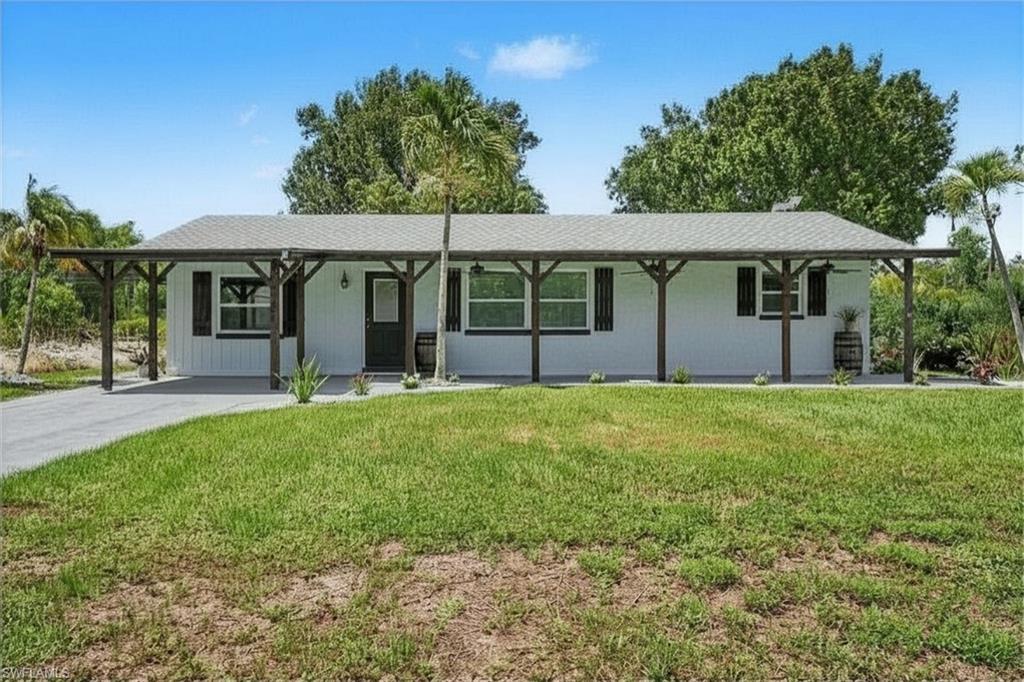 Welcome to an exceptional opportunity offering three beautifully renovated living spaces on one spacious property! The main residence features 3 bedrooms, 2 bathrooms, and approximately 1,800 square feet of thoughtfully updated space, PLUS an attached EFFICIENCY apartment and a DETACHED 2-bedroom, 1-bath Guest House - Additional Dwelling Unit (ADU), creating endless possibilities for multi-generational living, guest accommodations, rental income, or a private home office. The main home has been extensively renovated from top to bottom with updated electrical, plumbing, spray foam insulation, Argon gas windows, architectural shingle roof, central air conditioning with Wi-Fi thermostat, on-demand water heater, luxury water-resistant vinyl flooring, custom trim, six-panel doors, recessed lighting, Wi-Fi controlled ceiling fans, and fresh interior paint throughout. The stunning kitchen showcases custom cabinetry with Lazy Susan storage, custom tile backsplash, stainless steel appliances, under-cabinet microwave, and flexible faucet. The spacious living room is highlighted by a custom tongue-and-groove ceiling, built-in entertainment wall, and electric fireplace with customizable Wi-Fi lighting and heat settings. The attached efficiency apartment offers approximately 484 gross square feet (not included in the county heated living area) and is privately separated from the main home with locking French doors while maintaining its own exterior entrance. Complete with a full kitchen, full bathroom, washer/dryer combo, mini-split HVAC system, ceramic tile flooring, custom finishes, and private living space, it's ideal for guests or rental income. Also located on the property is a detached 588 -square-foot ADU (not included in the county heated living area) featuring 2 bedrooms, 1 bathroom, a full kitchen with new cabinetry and appliances, stacked washer/dryer, mini-split air conditioning, updated bathroom, ceramic tile flooring, French doors, and covered front porch. Outside, you'll find room for all your toys with ample parking for boats, RVs, trailers, and work vehicles. Two separate RV/camper hookups include electric and septic connections. Relax beneath mature oak trees or enjoy fresh fruit from the producing mango tree. Enjoy watching your 2 lemon trees mature and come to fruition. The extended front porch with three ceiling fans creates the perfect place to unwind. Located less than a half mile from a public boat and kayak launch and just minutes from pickleball, tennis courts, restaurants, shopping, and entertainment, this unique smart-home property offers incredible flexibility for homeowners and investors alike. Live in one residence while generating rental income from the others, accommodate extended family, or create the ultimate private compound.   An extraordinary offering like this is truly one of a kind!