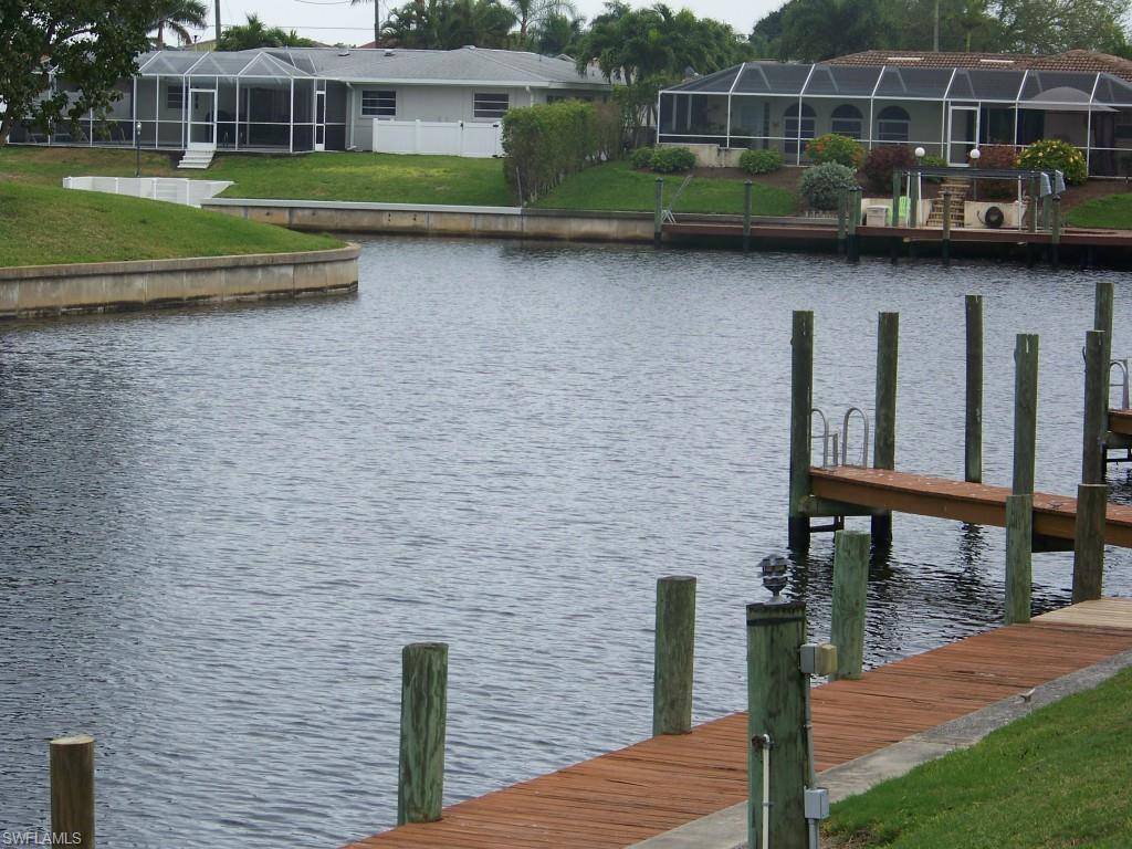 REDUCED $5K!!!  ATTENTION BOATERS!!! DIRECT access condo with NO bridges on the first floor/corner unit!  Boat slips are available(finger docks)for $25.00 a year on a first come/first serve basis!!AND.....you can have a boat lift if you choose at your expense!! Max boat size is 32 feet!!  This well maintained condo is just perfect....Entering from the courtyard you will find completely tiled floors, 2 bedrooms/2 full baths, updated kitchen with newer cabinets & shelves, newer windows and a very cozy all weather lanai.  Appliances are in great condition! Condo has a large heated pool with nice pavered decking, community room and pool baths.  Also newer roof, covered parking, extra outside storage and a tropical courtyard.  River is less than 5 minutes out!! Come take a look at this great condo...you'll be happy you did!