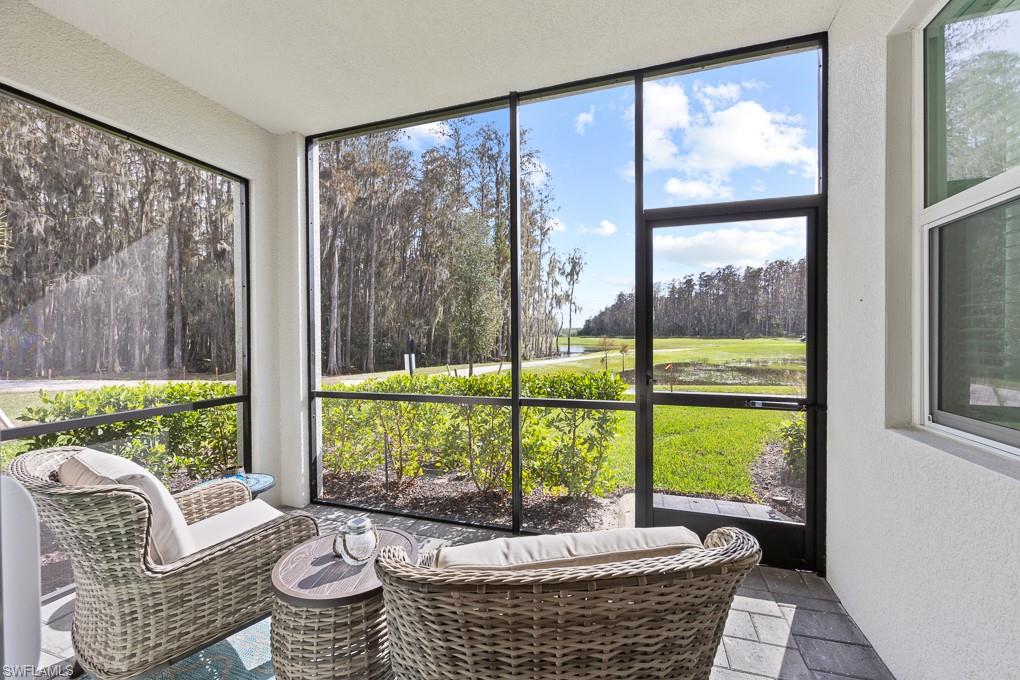 Welcome to an exceptional opportunity in The National Golf & Country Club at Ave Maria—now vacant and ready for immediate enjoyment or investment just in time for the 2026 season. This highly sought-after first-floor Birkdale model is being offered fully turnkey and move-in ready, ideal for seasonal use, rental income, or full-time living. This well-maintained condo offers 2 bedrooms, 2 bathrooms, and 1,154 sq. ft. of open-concept living and showcases the coveted trifecta of views—golf course, water, and preserve—creating a rare and serene backdrop. The kitchen features a large island, stainless steel appliances, pantry, and upgraded tile backsplash, flowing seamlessly into the living and dining areas. The screened lanai is the perfect place to relax and enjoy peaceful sunsets and scenic views. Upgrades throughout include crown molding, fresh designer paint, tasteful accent walls, and tile flooring throughout—no carpet. The owner’s suite offers a walk-in closet and an en-suite bath with a glass-enclosed shower, while the guest bedroom and full bath provide privacy and comfort for visitors. Additional features include impact-resistant windows and doors, a full laundry room, covered carport, and ample guest parking. The unit is conveniently located near a satellite pool for easy access. This condo includes a private bundled golf membership, providing unlimited access to the championship 18-hole course and world-class resort amenities, including resort and lap pools, fitness center with classes, full-service spa, pickleball, tennis, bocce, dining, and more. HOA fees cover cable, internet, water, trash, exterior maintenance, pest control, and 24-hour security for worry-free ownership. Turnkey. Vacant. Upgraded. Bundled with golf. Featuring rare views and a prime location, this Birkdale condo is ready to be yours for the 2026 season and beyond.
