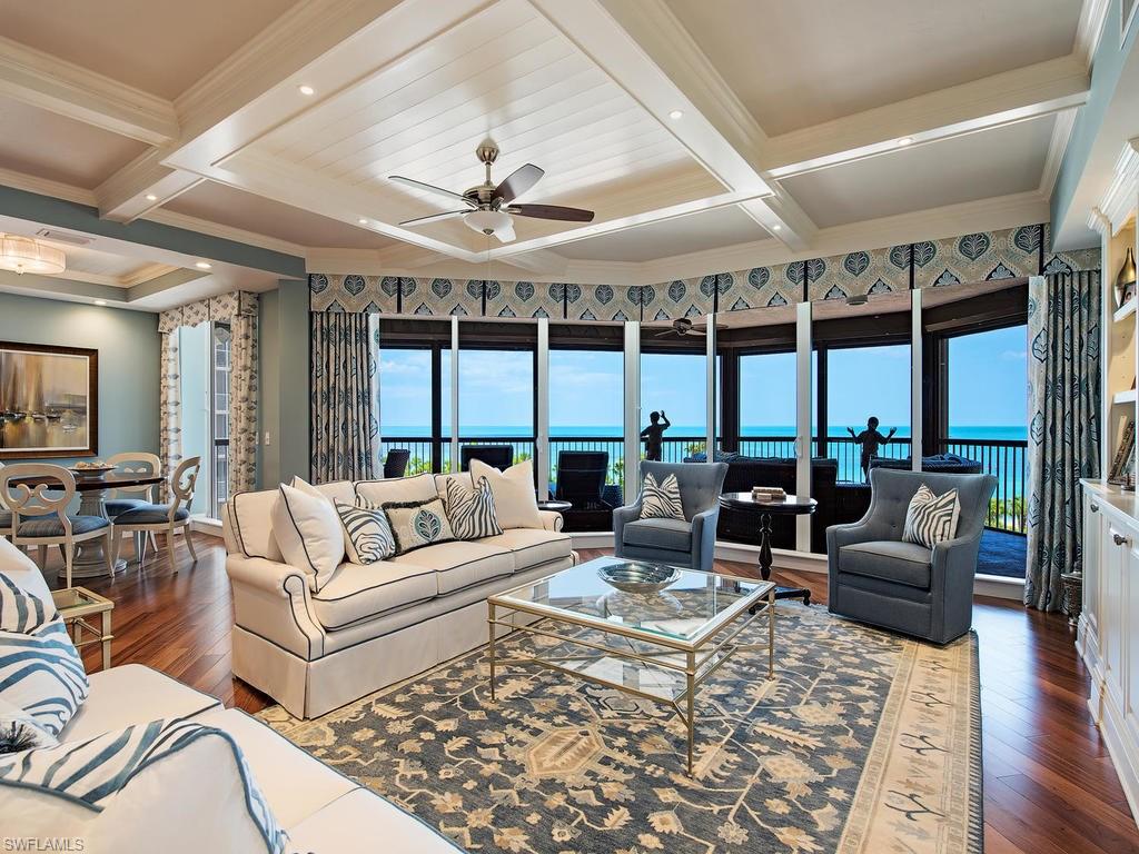 C.13579 - Simply a "piece-de-resistance" Masterpiece!!! You’ll wish to forever gaze at the endless celadon-hued Gulf vistas from this 2016 TOTALLY Re-Mastered and memorably SMASHING seaside-hued Biltmore at Beachfront Bay Colony JEWEL. A design palette of refreshing blues and whites, complemented by warm-tone hardwood flooring showcase the reformatted open floor plan, creating a sublime retreat. Generous Grand Salon showcases a full wall, white sleek, custom-crafted media center with all the tech toys, friendly dining, and artful serving bar, all back-dropped by stunning Gulf-Front views. The envious open chef’s dream kitchen naturally flows west to the breakfast room and east to the family room and offers granite tops, custom cabinetry, expansive center island, mosaic glass backsplash, and built-in stainless appliances. Yet another full-wall desk/media center graces the den/family room. Master Suite with stunning bath, custom closets, and blissful sunset picture window views is simply unsurpassed.Further pleasures include two split en-suite guest bedrooms, sharing a sunrise lanai, both with luxury bath appointments.