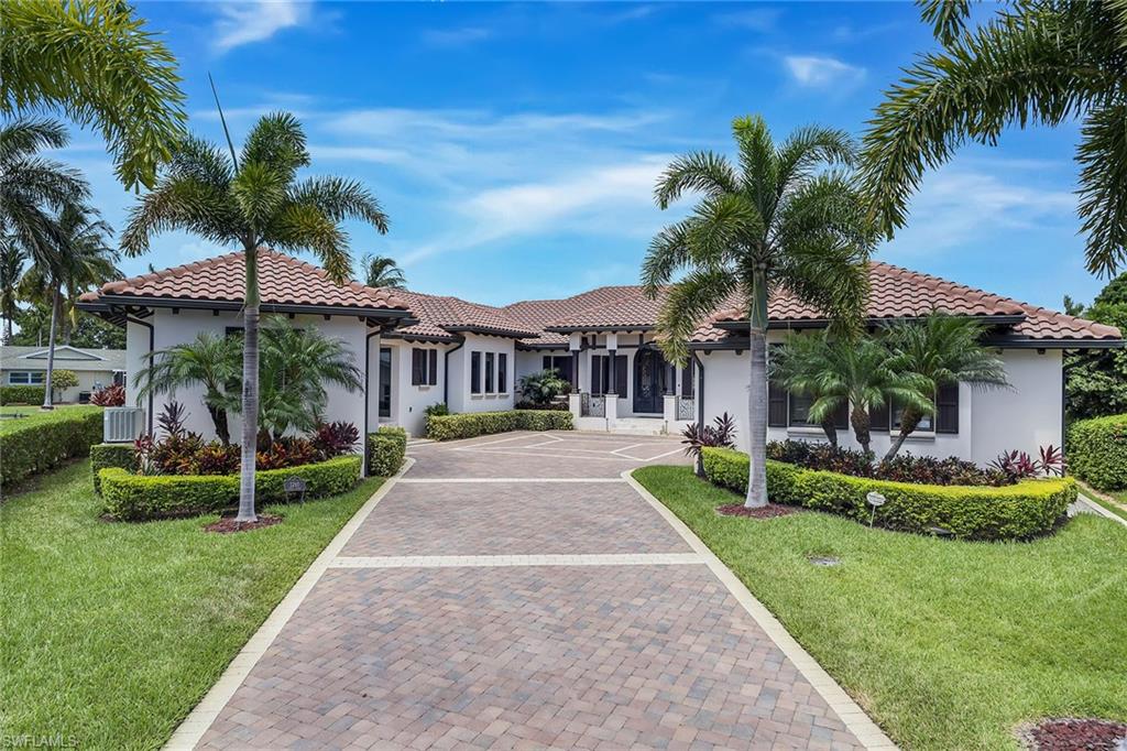 Like new home in sought-after Royal Harbor on a deep water tip lot with over 160’ of water frontage! Discover luxurious living at this one-of-a-kind, single-story residence complete with detached guest cabana, updated smart entertainment and sound, Control4 automation, air-conditioned three-car garage, resort-style pool/spa and outdoor fireplace! Each of the bedrooms have their own en-suite bathrooms, and the master retreat features a contemporary walk-in shower, dual sinks and large walk-in closet with dressing area. Home showcases pocketing sliders, motorized shades, plantation shutters and a true chef’s kitchen with top-of-the-line appliances including Wolfe gas cook-top, Sub-Zero refrigerator and dual Bosch dishwashers. Entertaining is a breeze with expansive outdoor living which encompasses a large living area with an outdoor fireplace. Residence is finished with two boat lifts, upgraded Aces pool lighting system and is conveniently located just a short distance from 3rd Street South and 5th Avenue South’s fine dining, world-class shopping and white sand beaches.