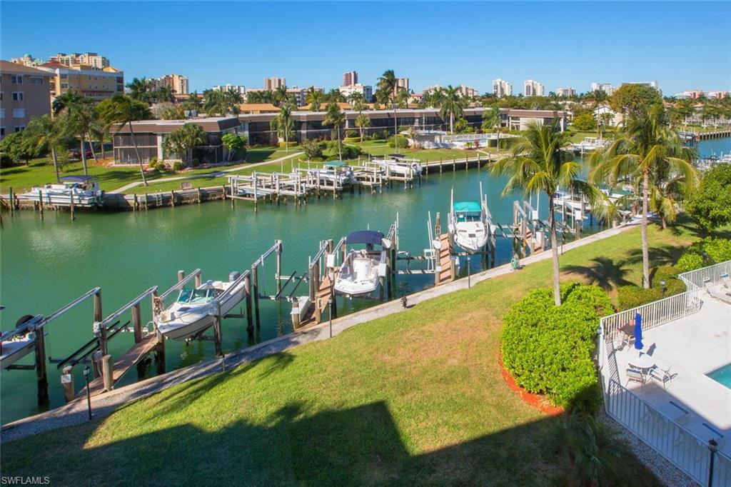 Best Buy on the Southend! Gorgeous 3 bedroom residence with private garage and deeded dock with lift boasts year-round sunsets, beautiful views of the Marco skyline, newly renovated interior, tile flooring throughout, granite countertops, and so much more. Enjoy a short egress to the Gulf of Mexico. Located in the desirable Southend of Marco Island, close to the beach!