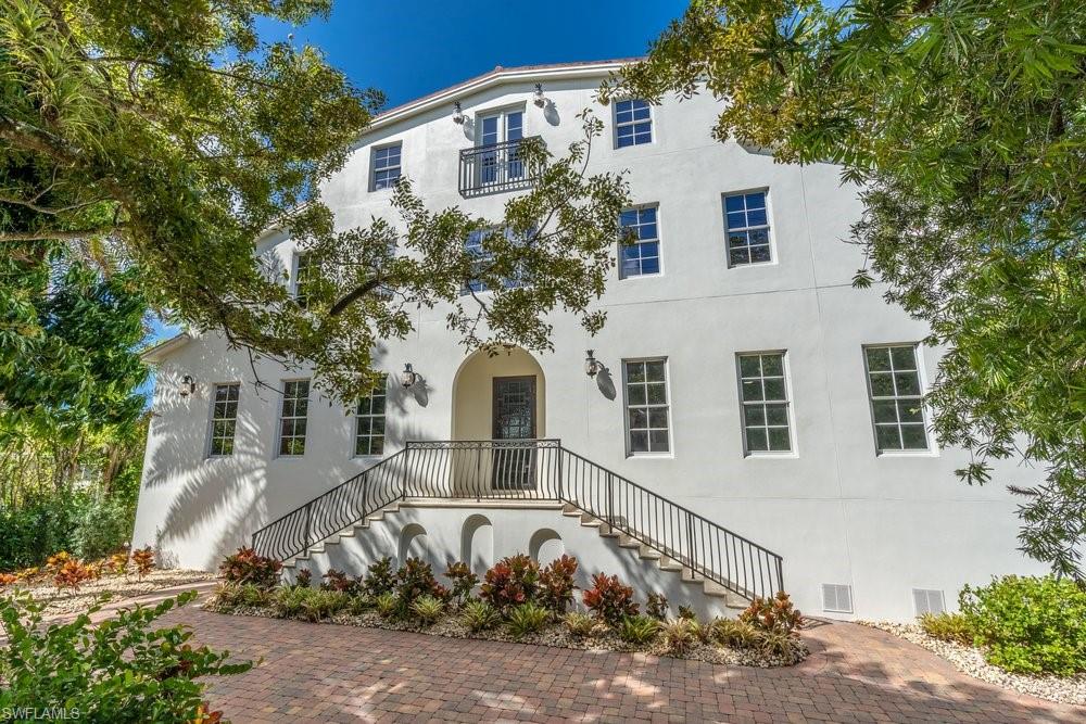 One or more photo(s) has been virtually staged, AI generated or rendered.  Price significantly reduced and now priced to sell. Offering nearly 6,000 square feet of luxurious living space, this exceptional Olde Naples residence features 6 bedrooms, 4.5 bathrooms, a private den, library, and an impressive third-floor bonus room ideal for entertaining, a media room, game room, or private retreat.

Designed for both everyday living and grand-scale entertaining, the gourmet kitchen is a chef's dream, appointed with Sub-Zero and Wolf appliances, dual dishwashers, and an oversized walk in pantry. A dramatic two story foyer, illuminated by an imported chandelier, welcomes you inside and leads to an elegant second floor mezzanine, complemented by a grand staircase and solid mahogany doors throughout.

The private backyard oasis features a heated saltwater pool with a tranquil water feature, surrounded by lush tropical landscaping and mature trees for exceptional privacy. From the expansive third floor terrace, enjoy spectacular bird's eye views while watching the City of Naples Fourth of July fireworks, an unforgettable experience from the comfort of your own home.

Perfectly positioned in the heart of Olde Naples, this fully remodeled residence is just a short walk to world-class beaches, renowned dining, boutique shopping, and boating. Additional highlights include garage ceiling height designed to accommodate a future vehicle lift, plus multiple flexible living spaces including an exercise room, family room, media room, and bonus room to suit a variety of lifestyles.

This is an exceptional opportunity to own one of Olde Naples' largest and most versatile homes at an outstanding value. Combining remarkable size, luxury finishes, and an unbeatable location, this move-in-ready residence is priced to attract immediate interest. Don't miss this rare opportunity, A must see!
