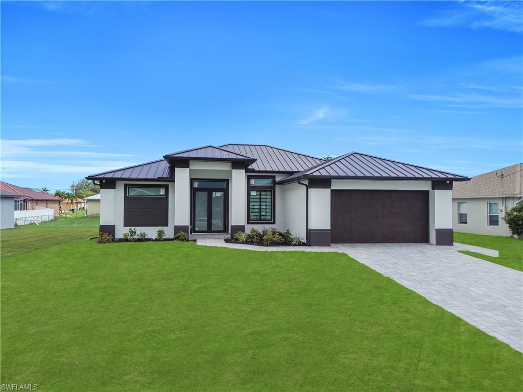Welcome to your dream home in Cape Coral! This stunning single family home boasts 4 spacious bedrooms, 3 luxurious bathrooms, and a 2 car garage for all your storage needs. The office space provides the perfect area for remote work or a quiet place to study. The modern kitchen features stainless steel appliances, perfect for whipping up gourmet meals for family and friends. The tile flooring throughout the home adds a touch of elegance and is easy to clean. The metal roof not only adds durability and longevity to the home but also gives it a sleek, zebra curtains to add privacy and a modern look and washer/dryer for better convenience . Imagine relaxing in your backyard oasis, enjoying the Florida sunshine and the peaceful surroundings of Cape Coral. This home is perfect for families looking for a spacious and stylish retreat in a desirable location. Don't miss out on the opportunity to make this house your forever home!