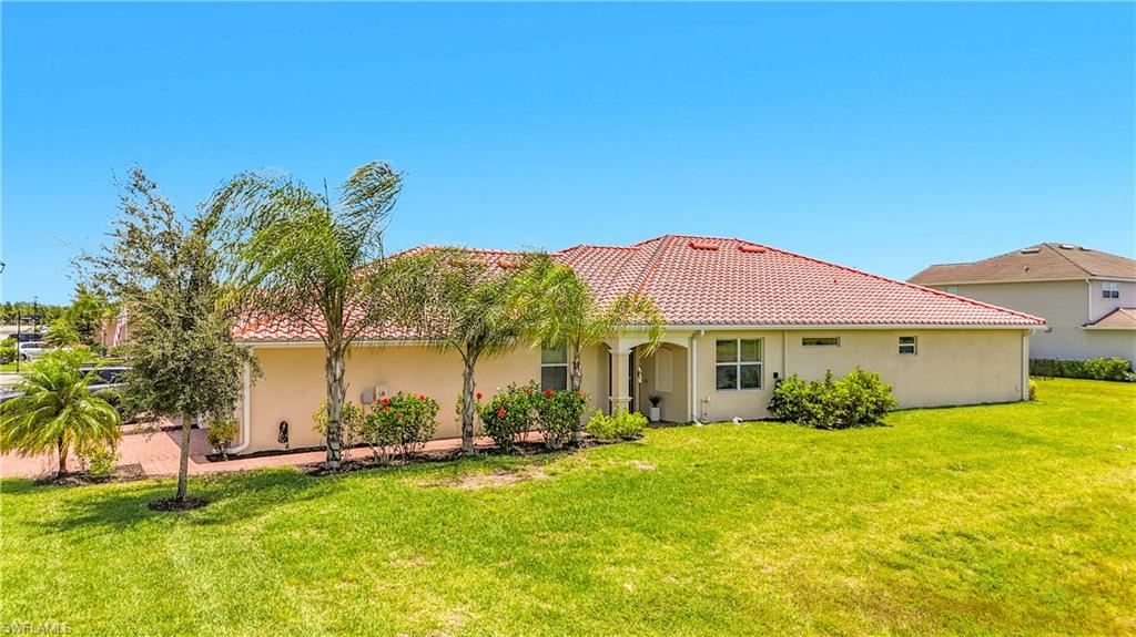 Step into this meticulously maintained Orchid Villa. Built in 2023, this 1544 sf 2-bedroom, 2-bathroom plus den, 2 car garage home features large, light-colored tile and soft white paint throughout, creating a bright and airy atmosphere. The kitchen boasts stainless steel appliances, white cabinetry, and white quartz countertops with delicate veining for a modern, sophisticated touch.
Designed for effortless living, the open floor plan is perfect for entertaining, while the split-bedroom layout ensures optimal privacy. In the living room, electric roll-down blinds make it easy to unwind at the touch of a button. The primary suite features a spacious walk-in shower, separate dual vanities, a private water closet, and double sliding glass doors that open directly to the screened-in lanai.
The versatile den/flex room offers serene pond views, while the generous guest bedroom sits just across the hall from the full guest bath. A dedicated laundry room includes a washer, dryer, and built-in shelving for additional storage.
Located in a secure, gated community, the resort-style amenities will make you feel like you're on vacation every day. Enjoy a luxury clubhouse with a catering kitchen, a fitness center, tropical tiki huts, two large pools, a hot tub, tennis courts, beach volleyball, basketball, a kids' splash area, and a playground. Sidewalks offer safe paths for walking, running, and cycling, while the HOA conveniently covers lawn care and irrigation for true peace of mind.
The Ranch at Orange Blossom is situated close to newly emerging shopping and dining options—including an adjacent Publix supermarket—and all three top-rated public schools are just a short distance away.