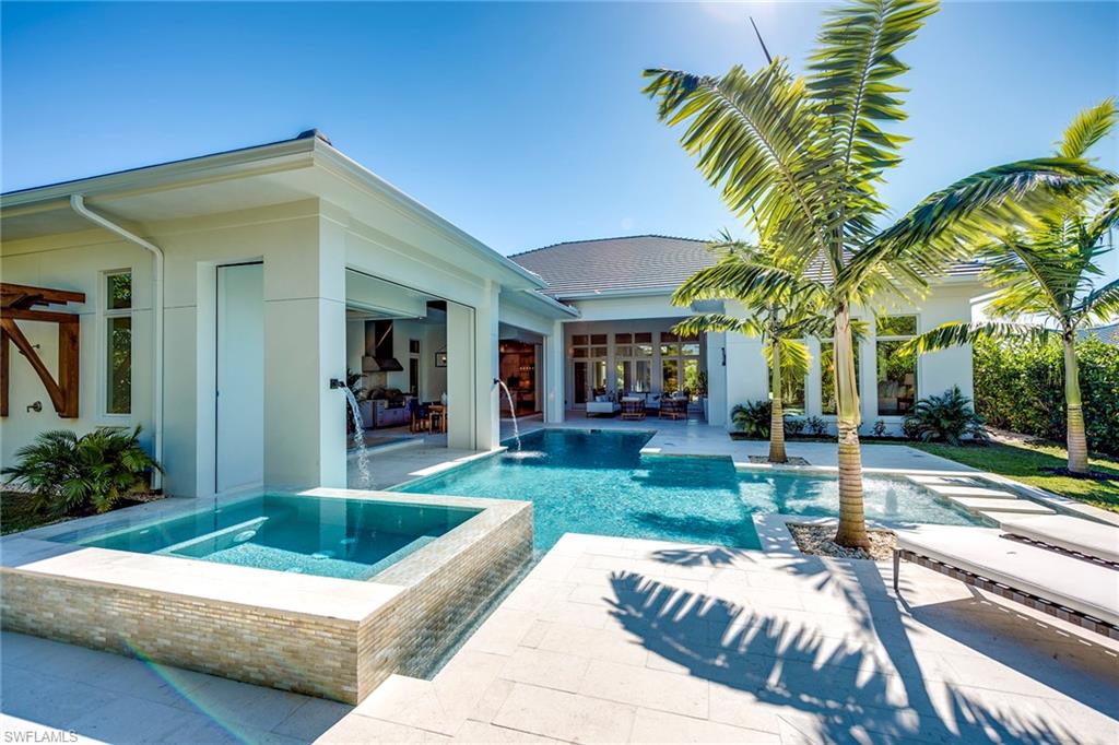 Completed in 2019. Designed by Falconer Jones and built by Knauf Koenig. This exceptional one level home on a quiet non-thru street in the Moorings offers close proximity to pristine beaches, Venetian Village and Waterside Shops. Masterfully designed around a stunning pool and spa with no detail overlooked. Extensive millwork and Legno Bastone wide plank wood floors are complemented by hand selected marble/stone, Ruffino cabinetry throughout and Sub-Zero-Wolf appliances in the open kitchen and wet bar. Pantry kitchen includes a second refrigerator, dishwasher and microwave/convection oven. Andersen and WinDoor windows and doors open to 1,780 sf of covered outdoor living including a dining area, gas fireplace and built in grill overlooking the expansive sun filled pool/spa and generous grassy backyard with outdoor shower. Electric screens and storm shutters included. Additional $50K in upgrades include Cristallo countertop kitchen island, Walker Zanger tile, control 4 automation with Lutron smart lighting. Prewired for sound system in both interior and exterior. This spectacular home is not to be missed. Home is eligible for membership to the private Moorings Beach Club.