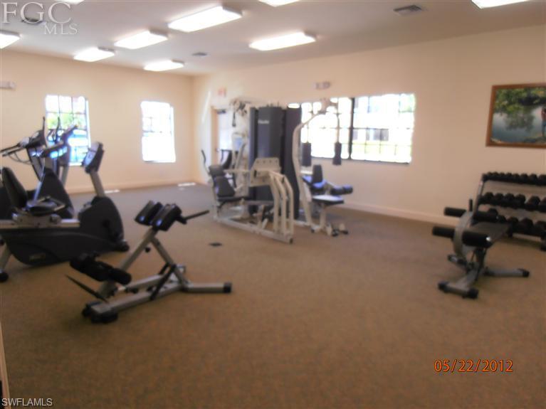 Beautiful gated community with pool/spa and 24 hour fitness room. Picnic area surrounded by trees. Features semi private elevator that takes you right up to your living room. Property has weekend security.  This community is central to malls, shopping, dining, major highways and interstate. Minutes to FGCU college. Bus stop within walking distance and school bus stops at front entrance to property. Unit will have new carpet and paint. Large rooms with private balcony. This unit has a courtyard view and partial lakeview.