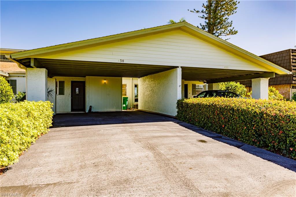 2 bed 2 bath attached villa 5 miles to downtown Naples! It offers single level living (no worry of noise coming from upstairs!) with an attached 2 car covered carport and an in-home washer and dryer, plus a comfortable screened lanai! Many design updates include: crown molding and baseboards throughout, no popcorn ceilings, raised ceilings in both bathrooms, tray ceilings in kitchen and dining area and custom closets! Updated mechanicals include a new AC in 2017 and water heater in 2014. Riviera Lake Villas is a 55+ community is located next to Riviera Golf Club and is convenient to shopping, restaurants and beaches!