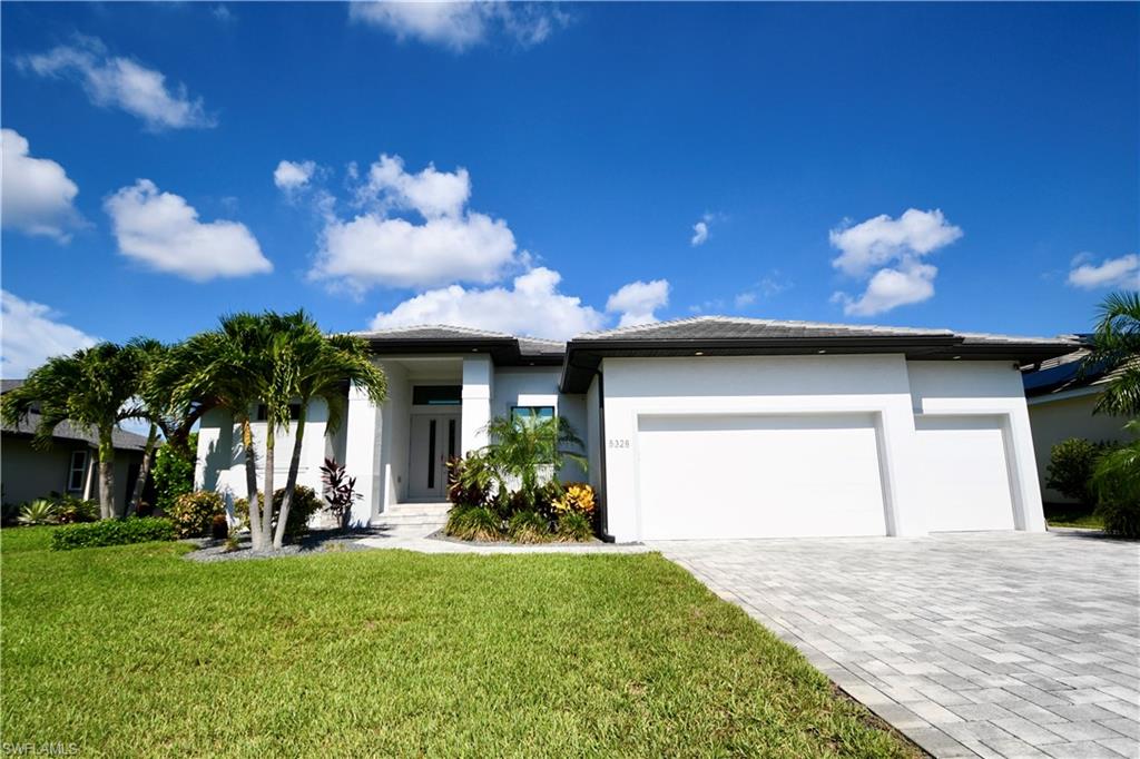Exceptional custom craftsmanship and thoughtful design define this beautifully maintained residence in the highly desirable Southwest Cape Coral area. Offering 3 spacious bedrooms, a private den, and 3 full bathrooms, this home showcases upscale finishes and impressive upgrades throughout.

The open-concept floor plan is designed for both comfortable living and effortless entertaining. The gourmet kitchen features premium cabinetry, Cambria quartz countertops, custom white Café appliances, a large center island, and abundant storage, all seamlessly flowing into the expansive great room. Soaring ceilings, custom architectural details, and an abundance of natural light create an inviting and elegant living space.

The luxurious owner's suite serves as a private retreat, featuring a spa-inspired bathroom with dual vanities, a walk-in shower, a separate soaking tub, and an oversized custom-designed walk-in closet complete with built-in cabinetry, a full-length mirror, and a designer chandelier. One of the secondary bedrooms offers its own private en-suite bathroom, providing the perfect space for guests or multigenerational living.

Additional upgrades include impact-resistant windows and doors, stackable accordion shutters for the lanai, upgraded flooring, tray and coffered ceilings, custom built-ins, and high-end finishes throughout.

The outdoor living area perfectly captures the Southwest Florida lifestyle. An expansive lanai overlooks the beautiful pool and offers multiple seating areas for relaxing or entertaining, all surrounded by professionally landscaped grounds. Whether enjoying a quiet evening at home or hosting family and friends, this exceptional property delivers the perfect blend of luxury, comfort, and convenience.

Ideally located just a short walk from Cape Harbour, residents can enjoy waterfront dining, boutique shopping, live entertainment, and a vibrant marina atmosphere right in their own neighborhood. This prime location offers convenient access to some of Cape Coral's most popular restaurants and shops, adding to the convenience and enjoyment of everyday living.