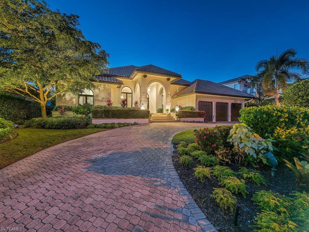 H.13999 -  Venetian Bay with direct WESTERN EXPOSURE & long water views to the southwest, featuring 100 FEET OF WATERFRONT with boat lift & ample dock space to set out for the Gulf of Mexico!   Wide open floor plan and dazzling views of the water from the moment you walk in. The interiors feature as high as 12' ceilings brilliant Travertine marble, Wide plank washed light oak flooring, remodeled baths. Exotic Brazilian Ipe decking coupled with keystone pool and lanai decks enhance the outdoor spaces. Under high, clear cypress tongue and groove ceilings, the lanai offers plenty of room for elegant outdoor dining while taking in the spectacular views.  The rear of the home features step down decking to a tiered garden featuring a stone pathway that meanders under the 40 foot coconut palms. A one family home that has been enjoyed and meticulously maintained.. ready to welcome the next owner!