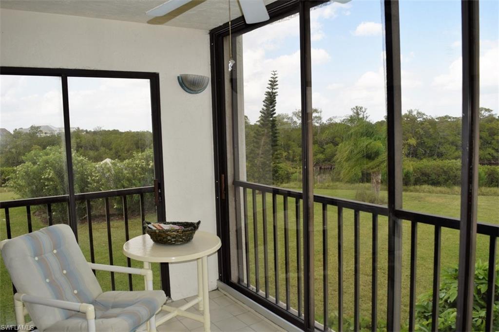 Don't miss this chance to own a CORNER, 2 bedroom, 2 bath Bay Village unit with stunning landscaped lawn and lagoon views!  Another special part of this unit is that the lanai is glassed in, making it a perfect spot to enjoy the views in all types of weather.  With an eastern exposure, it's a perfect place to enjoy the morning sun or relax away from the sun in the afternoon.  The unit is tiled in the main living area and both bedrooms are carpeted.  The dining area has bay windows with lovely lagoon and lawn views.  The owner's suite has direct lanai access and beautiful views from the large window.  The refrigerator, washer/dryer and water heater are all just a few years old.  A convenient under building parking space and extra storage (directly adjacent to the parking space) complete this package. Bay Village amenities include a large community pool, shuffleboard, BBQ grills, tennis courts and a beautifully landscaped, park-like setting.  If you love the beach, it's just a short walk to our wide, sandy beach!