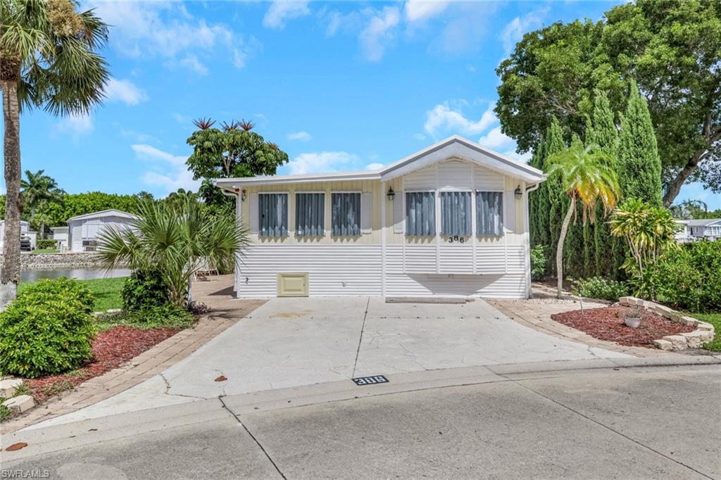 Imperial Wilderness R.V. Resort:55+ community: 1994 Chariot Eagle park model, situated in a cul-du-sac, on the water, rare over sized water front(sea wall)( 90 feet of lake front),1 bedroom, 1 semi-private sleep space, separate laundry room and half bath. New stove, new refrigerator, new microwave, new dishwasher, new water heater, new high-efficiency mini-splits A/C and heat, luxury vinyl floors, fabulous paved patio, pavers all around the house, furnished, beautifully landscaped, shingled roof, a slice of paradise. Site includes:Water, Sewer, Cable T.V., Irrigation, Tel. availability, Heated swimming pools and jacuzzis, Tennis court, Shuffleboard, Welcome center, Clubhouse with dance floor and banquet facilities, pool tables, Library, Laundries, restrooms with showers, planned social activities and events, GATED SECURITY, OWN YOUR LAND.
