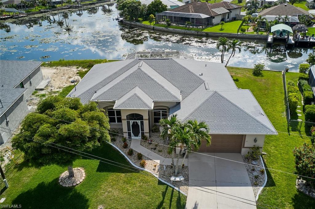 4 BEDROOM/2 FULL BATHS/FRESH WATER POOL HOME ON INTERSECTING CANALS W/2170SF UNDER AIR! NO FLOOD INSURANCE REQUIRED. What a home not to be overlooked! Tracy Built "Good Cents" home built in 2001 but has the feel of a 2023 home! Very well-maintained!  Sits on an over-size lot with concrete dock & approximately 125' of seawall! Beautiful view of water from almost every window! Roof installed in 2019 with Leaf Filter cover gutters in rear of home.  Kichen recently updated & has new LG black stainless appliances. House is perfect for entertaining both 'inside' and 'outside'.  Extremely spacious lanai/pool area.  Miami/Dade Accordian shutters on lanai with a new set of roll downs installed to be able to allow light through & keep the heat of the sun out. Entire home has been roto-rootered & pipes cleaned out in March, 2023.  No surprises expected!  Air-conditioner replaced in 2017 & serviced regularly.  Like I said - this home has been very well maintained & will be a great house to call home! Close to Cape Coral Hospital & Pine Island Coordinator.  SELLER WILL ENTERTAIN ALL OFFERS.