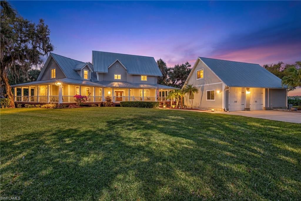 An Iconic Opportunity to own a true landmark of Historic Old Florida, One of the areas's most distinctive Waterfront Estates. It is reminiscent of the days when Henry Ford and Thomas Edison vacationed in SWFL, this timeless 1916 estate blends rich heritage with modern comfort. Thoughtfully and seamlessly expanded in 2000, the home preserves its historic integrity while enhancing modern functionality. Situated on just over an acre of beautifully landscaped, unrestricted riverfront property along the Northern side of the Caloosahatchee River, this hidden gem is surrounded by multimillion-dollar riverfront estates and framed by majestic oak trees, creating a picturesque Old Florida setting with natural shade, privacy, and a nostalgic feel from the moment you arrive. The property offers Direct Gulf Access with deep water frontage; Ideal for boaters and water enthusiasts, launch from your private on-site ramp for effortless days on the water, or simply relax and take in breathtaking sunrise & sunsets and panoramic river views from the expansive wraparound deck. As you enter the home, you immediately feel a warm, inviting atmosphere blending cozy charm with the elegance of a luxury waterfront estate.The Unique floor plan flows effortlessly for both everyday living and entertaining, Home Features 5 bedrooms & 3.5 Baths, High Ceilings, Porcelain Plank Tile Flooring, Spacious Family, Dining & Living areas, An oversized Laundry and utility room. Multiple doorways lead to the wraparound deck, providing a variety of sitting areas to enjoy serene river views and much more. The newly updated custom chef’s kitchen is a showpiece, with quartz countertops, sharp-edge high-end appliances, an induction cooktop, standalone ice maker, Bluetooth-compatible smart oven and microwave, custom soft-close cabinetry and drawers, and much more. Perfect for cooking, dining, and entertaining with breathtaking river views as your backdrop.Updates and Highlights include (but are not limited to): 2 HVAC systems, 2 water heaters, Electrical & Plumbing, Whole-house Reverse Osmosis System, Central Vacuum System, Low-E energy-efficient Windows and Sliders, Full-size pantry, Cedar Closets and abundant storage throughout all while preserving it's classic charm. Bonus: Assumable Flood Insurance Policy of just $1,464 annually, providing substantial savings to the new owner. An oversized pole-barn-style 2.5-car garage features high ceilings, a separate workshop, and a loft for additional storage offering ample space for tools, hobbies, or all the joys of country and waterfront living. Conveniently located near shopping, dining, I-75, and Babcock Ranch an area experiencing continued growth and development yet peacefully tucked away, this one-of-a-kind estate has been the heart of family gatherings, celebrations, and weddings for over 30 years and is ready to continue that legacy for generations to come. Endless opportunities await the right buyer. Schedule your private showing today!