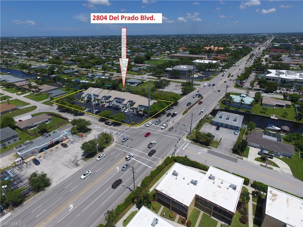 Prado Place is a two story multi tenant, with Gulf access, office building located at the signalized corner of Del Prado Blvd. South and SE 28th Terrace. This building consist of 18 units, 16 units are 1,000 square feet on average, one is 1,800 sf unit and the remaining office spaces are office suites on the second floor. Building could be purchased as an investment property, or could be potentially for the end user since many tenants are on a month to month basis. New metal roof in 2023, FLU: CP, Zoning: P, DOR Code: 18, Land: 48,982sf, City water, sewer and irrigation is in, and paid in full. Note: building plans are attached.