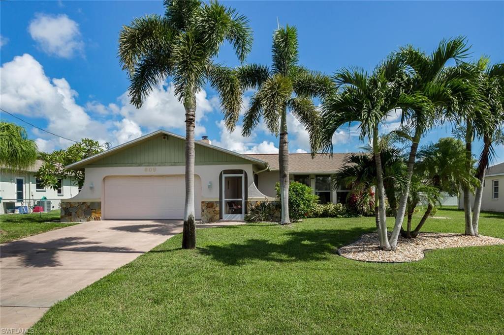 With a great central location off Academy Blvd, don't miss out on this fantastic opportunity to own a pool home with city utilities installed & paid! This home is MOVE IN READY! A/C and DUCT WORK was replace about a year ago.  The kitchen, wet bar & baths have been updated since the original construction w/new faucets, counter tops & cabinet doors, the entire house has been re-piped (no copper), newer water heater, interior has been painted, new carpet & brand new entry screen enclosure. This home also features a working fireplace, wet bar, wood like floors in master bedroom & living area, new carpet in 2 bedrooms & tile floors everywhere else...Not to mention the lovely mature palm trees, stamped concrete driveway & water feature by the front door. The sparkling pool invites you outside to the large screened lanai with the added bonus of having a pass through window to the kitchen. You also have an extra concrete slab out back for your bar-b-q grill & lounge chairs. Call today for your own private showing before this one is gone!