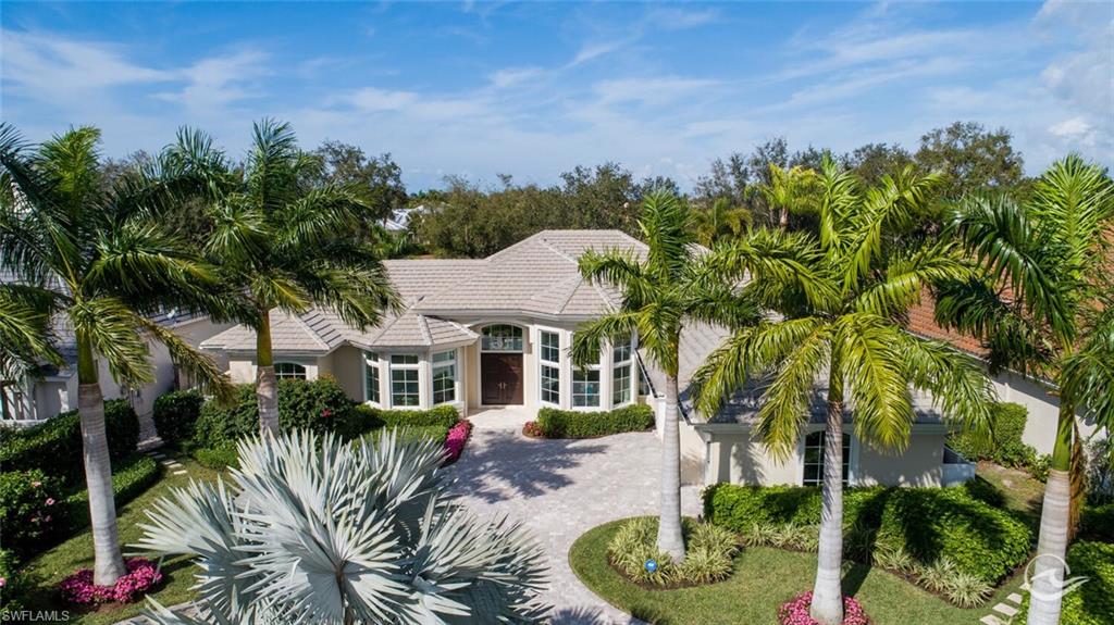 Sweeping golf course views abound from this pristine estate home nestled on the Bay course in coveted, beach front community of Pelican Bay. Filled with natural light, featuring gorgeous custom mill work, soaring 15’ ceilings, impacts windows, and wide plank hardwood floors throughout, no detail was overlooked in this open concept 3BR/den, 4 bath, 3 garage perfectly maintained beauty. A Stofft Cooney original, it was recently completely remastered by BCB Homes to feature 2 gorgeous indoor living spaces, a chefs kitchen with Wolf/Subzero appliances & Ruffino custom cabinetry, and a secluded outdoor living space overlooking the saline pool/spa, and gracious golf course views beyond. A gorgeous fireplace, motorized Lutron shades, Sonos sound system, exterior security cameras, whole house water filtration system are just some of the many features offered in this perfectly customized estate. Walk or bike to the beach, dinner, shopping… this location can’t be beat. Pelican Bay amenities include private access to 3 miles of white sand beaches; two beach clubs with dining; an active tennis program; 27 holes of golf and more. Moments from waterside, Artis-Naples, Mercato.